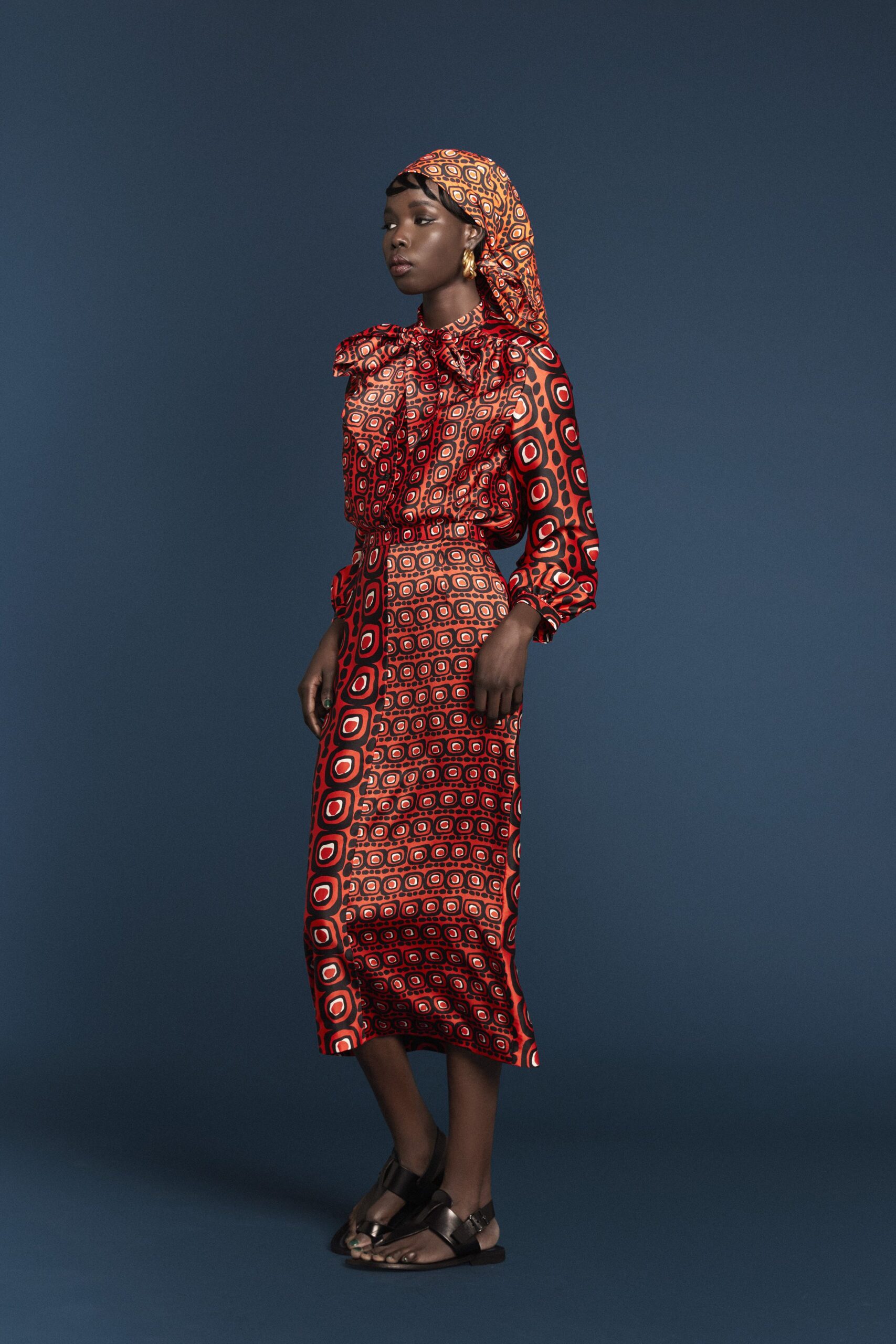 red cotton long-sleeve collared fitted printed pleated dress