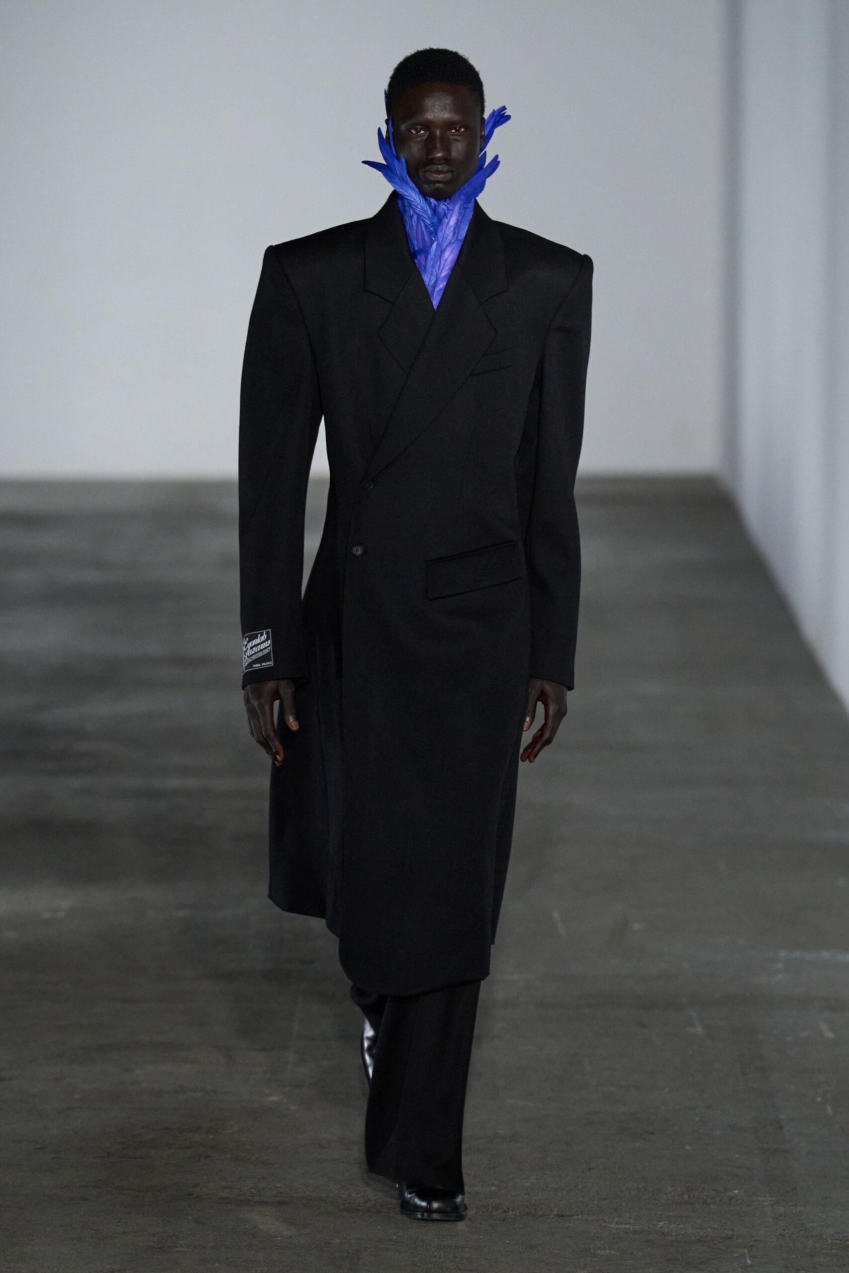 black tailored blazer with blue scarf
