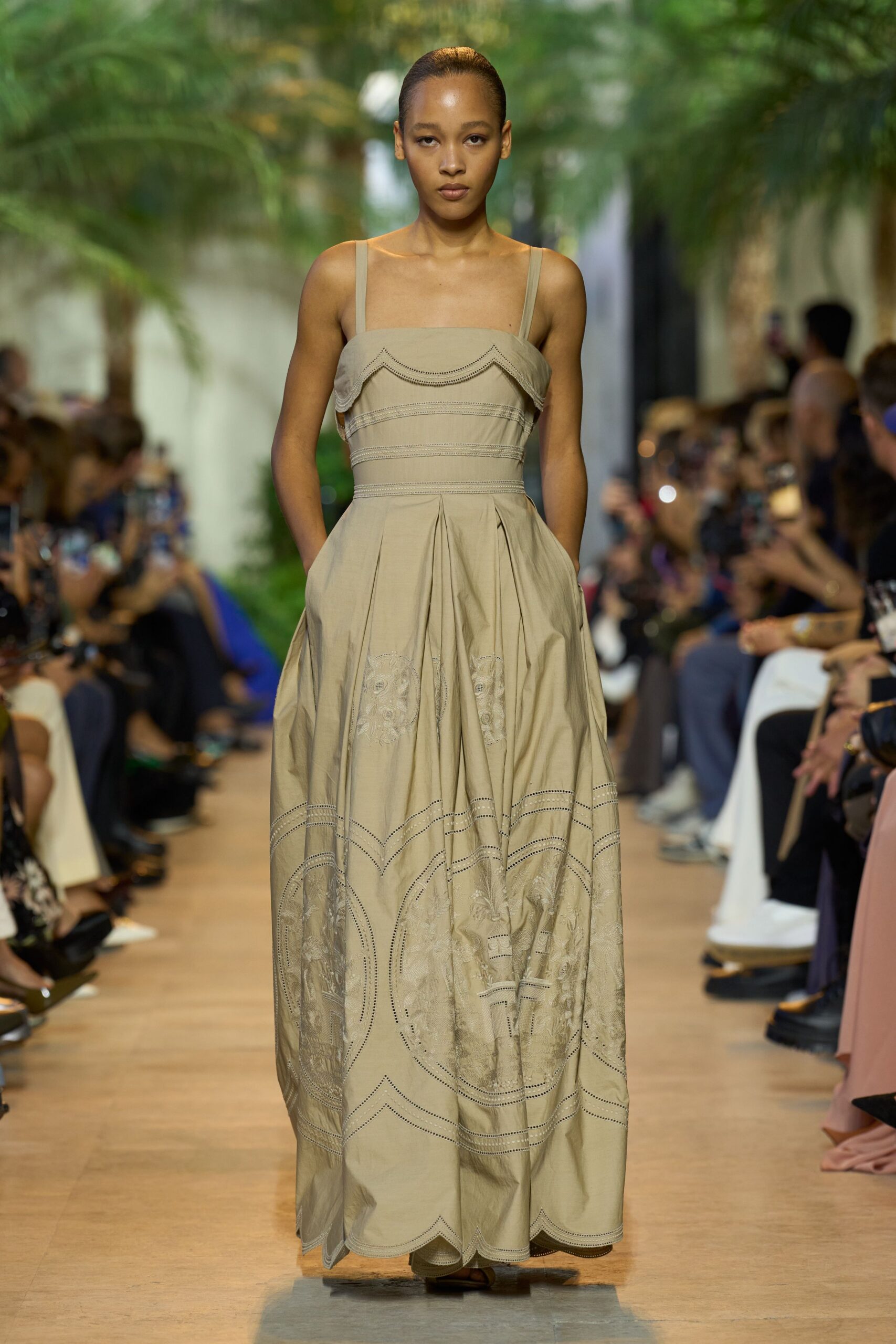 beige sleeveless pleated gown