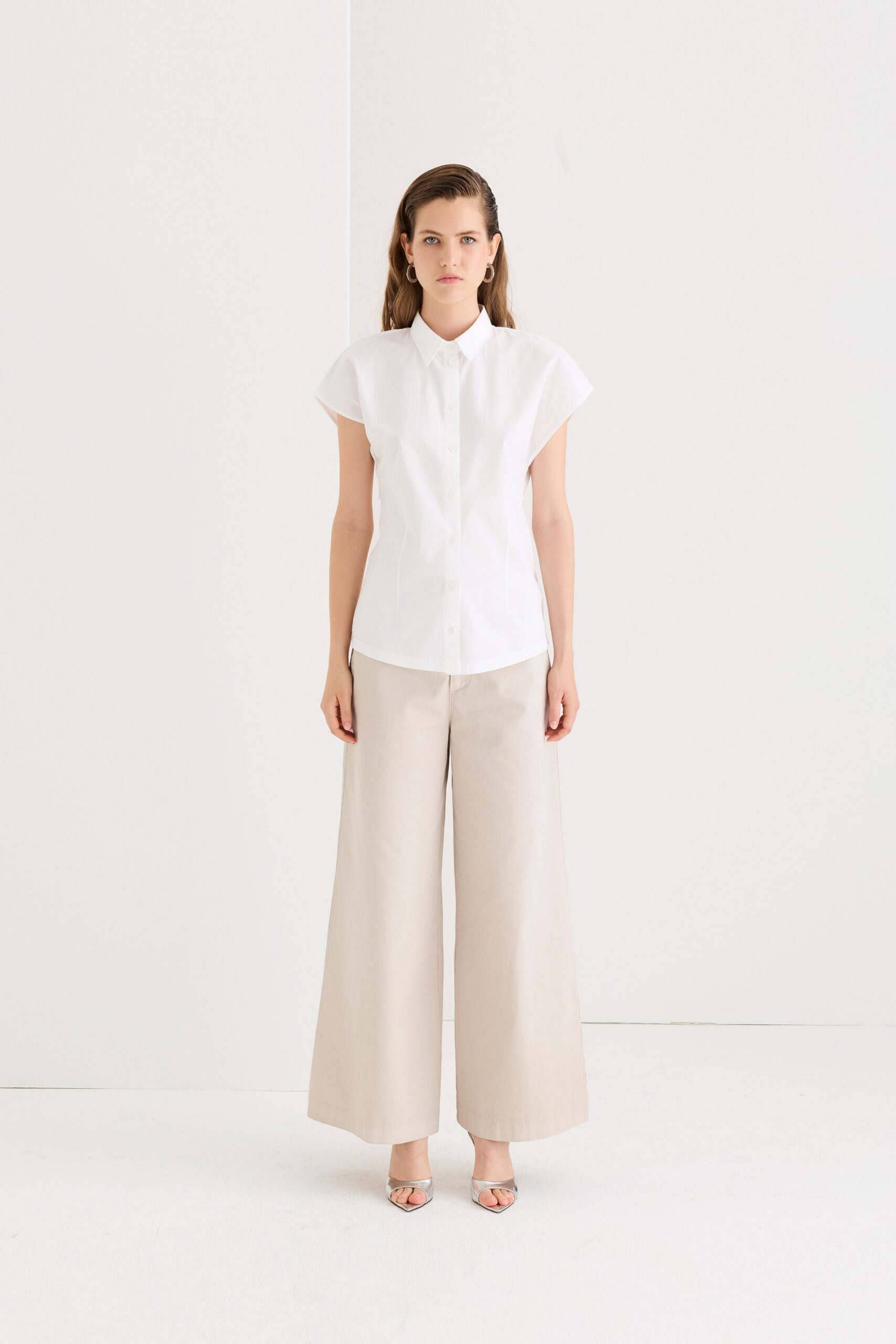 white shirt beige wide-leg pants