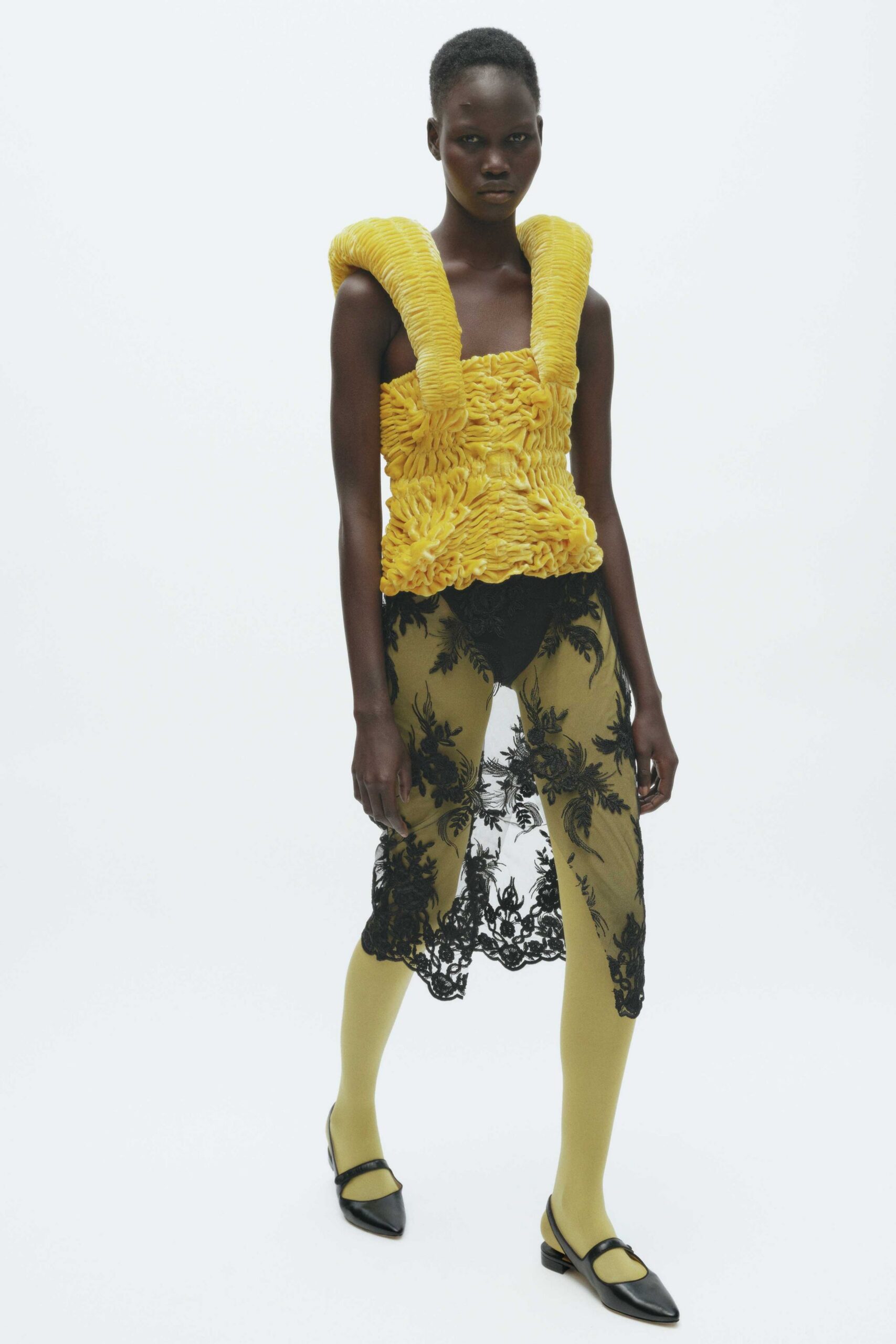 yellow ruffled top with lace skirt
