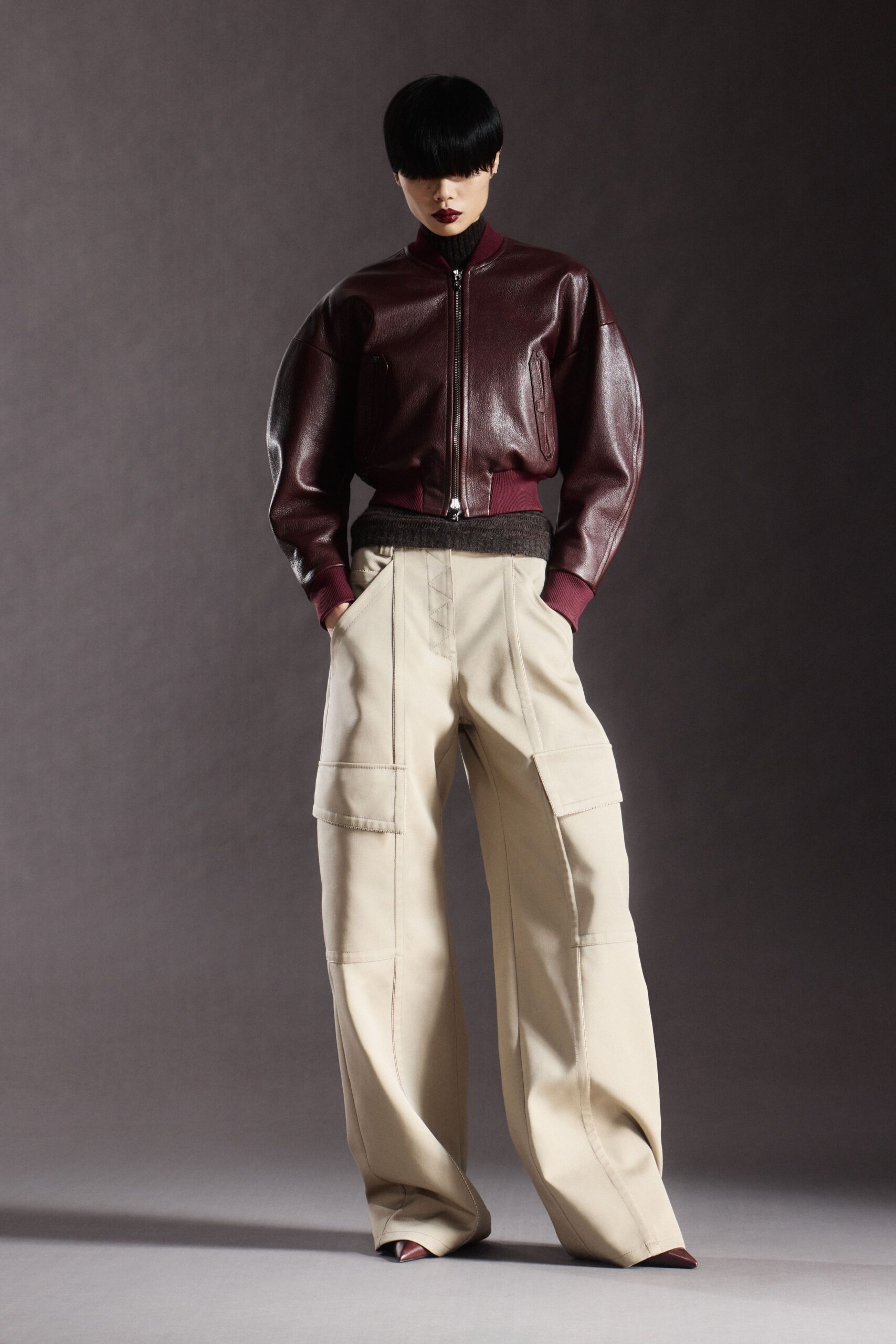 maroon leather jacket beige pants