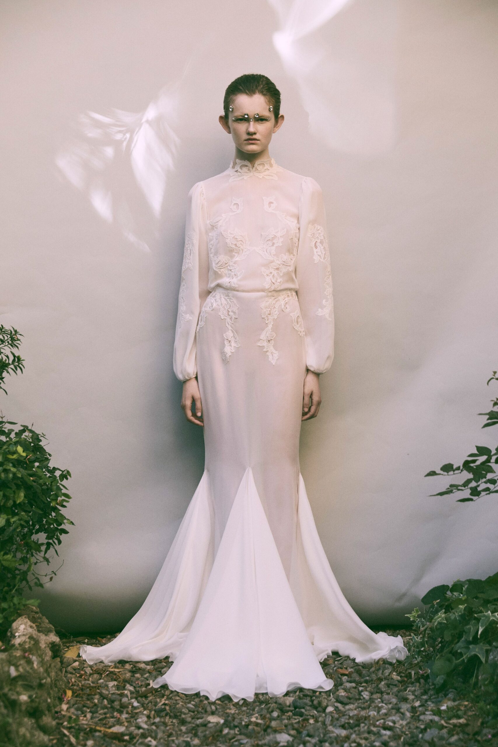 white silk long-sleeve gown