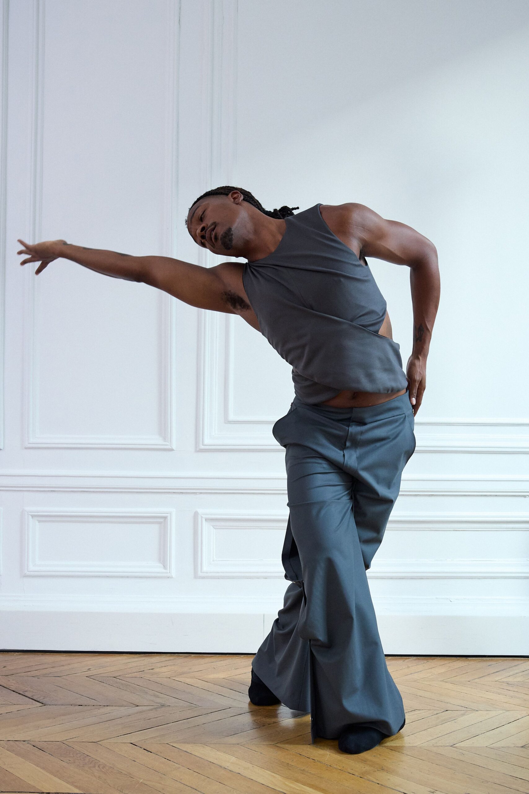 gray sleeveless top and relaxed pants