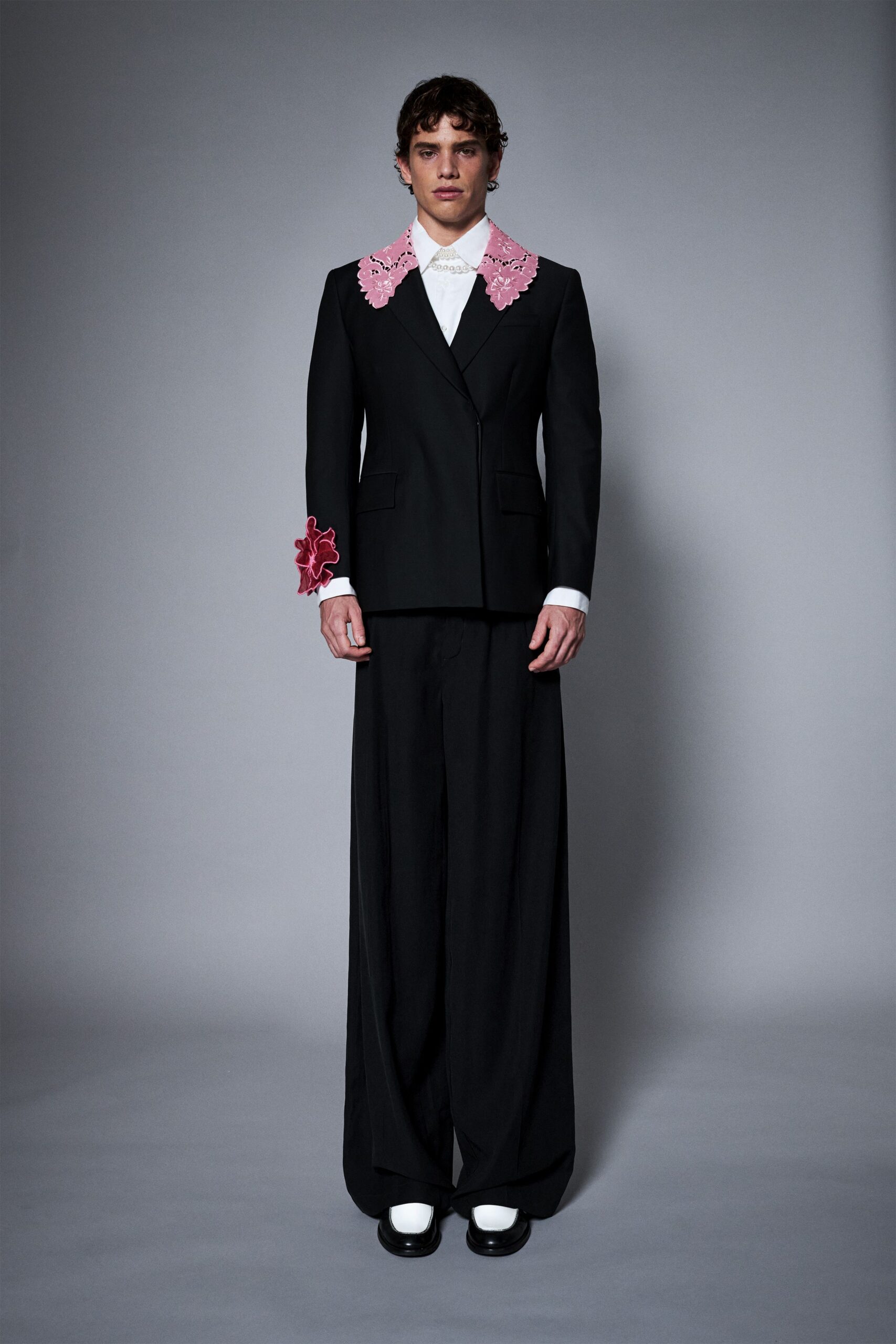 black wool long-sleeve collared tailored buttoned flared suit