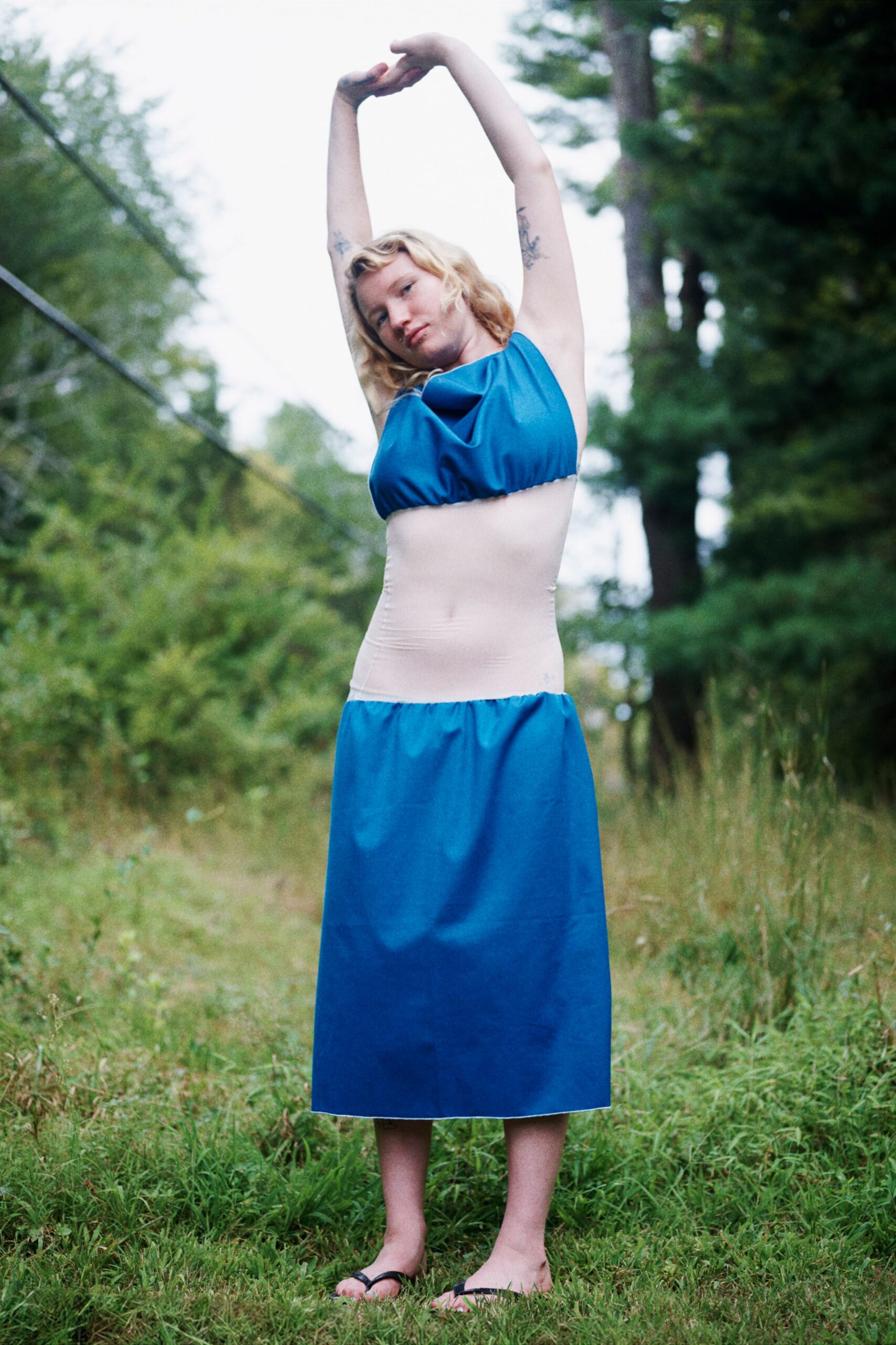 blue fitted midi dress with black shoes