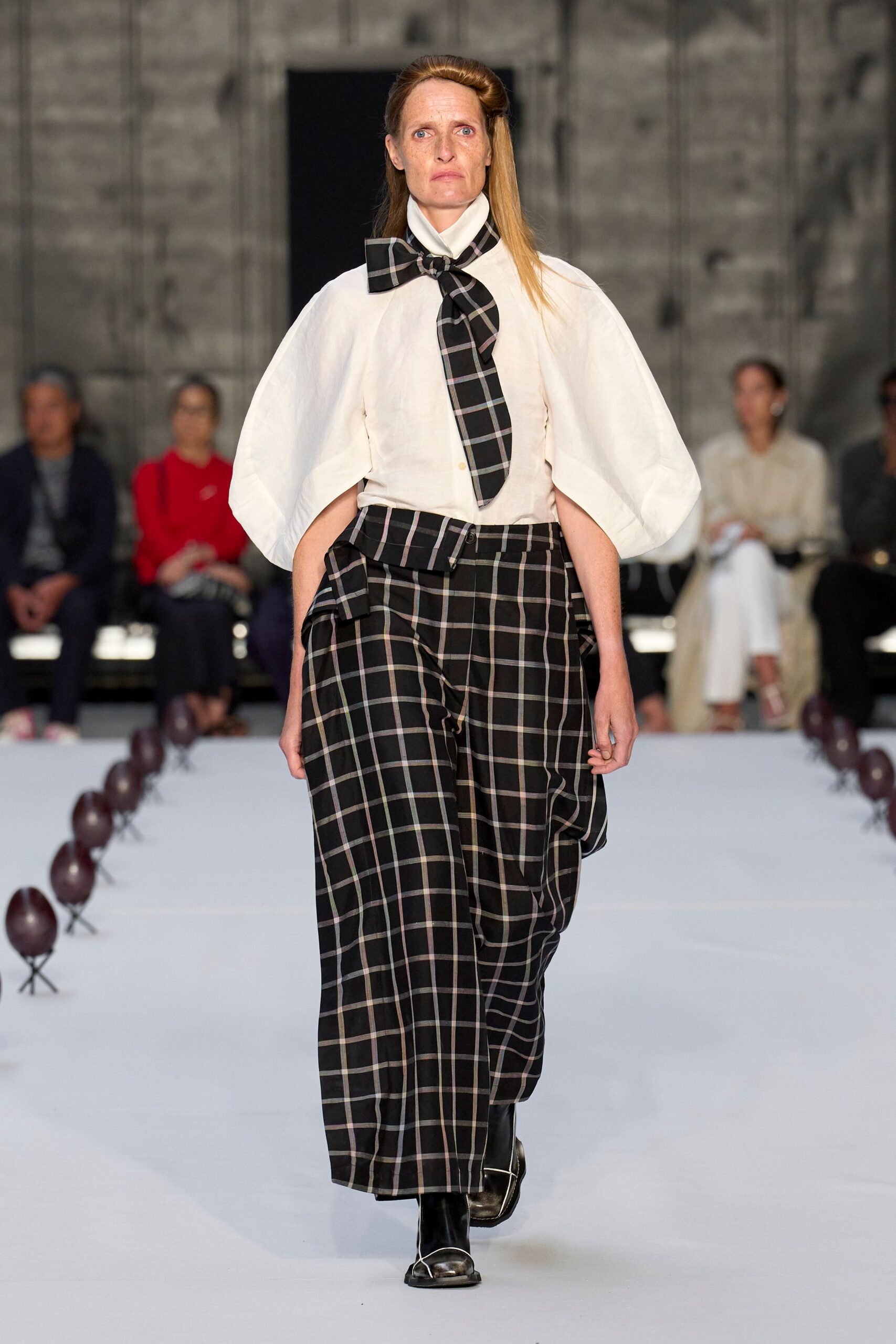 white relaxed shirt with black checked pants