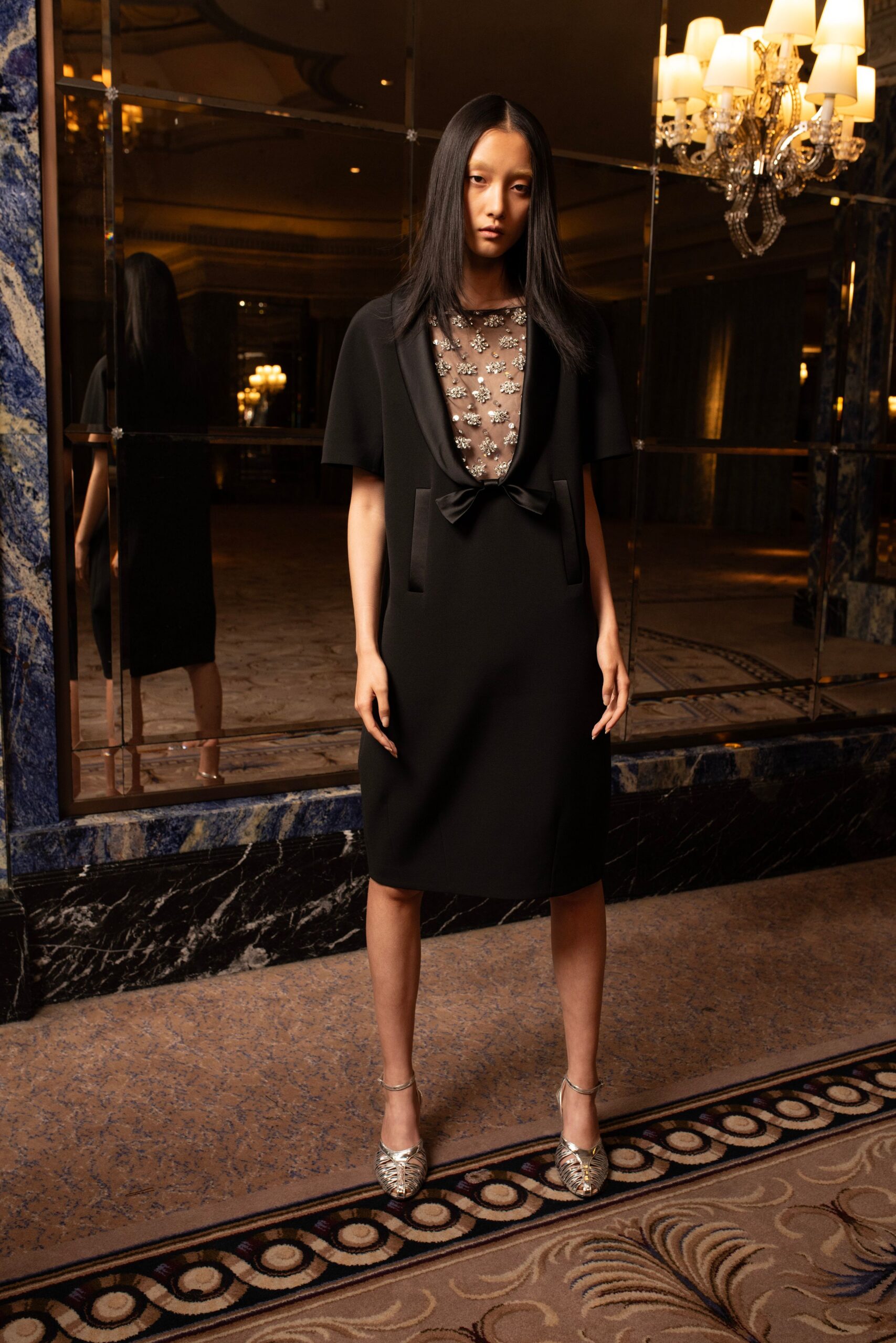 black beaded midi dress with silver shoes