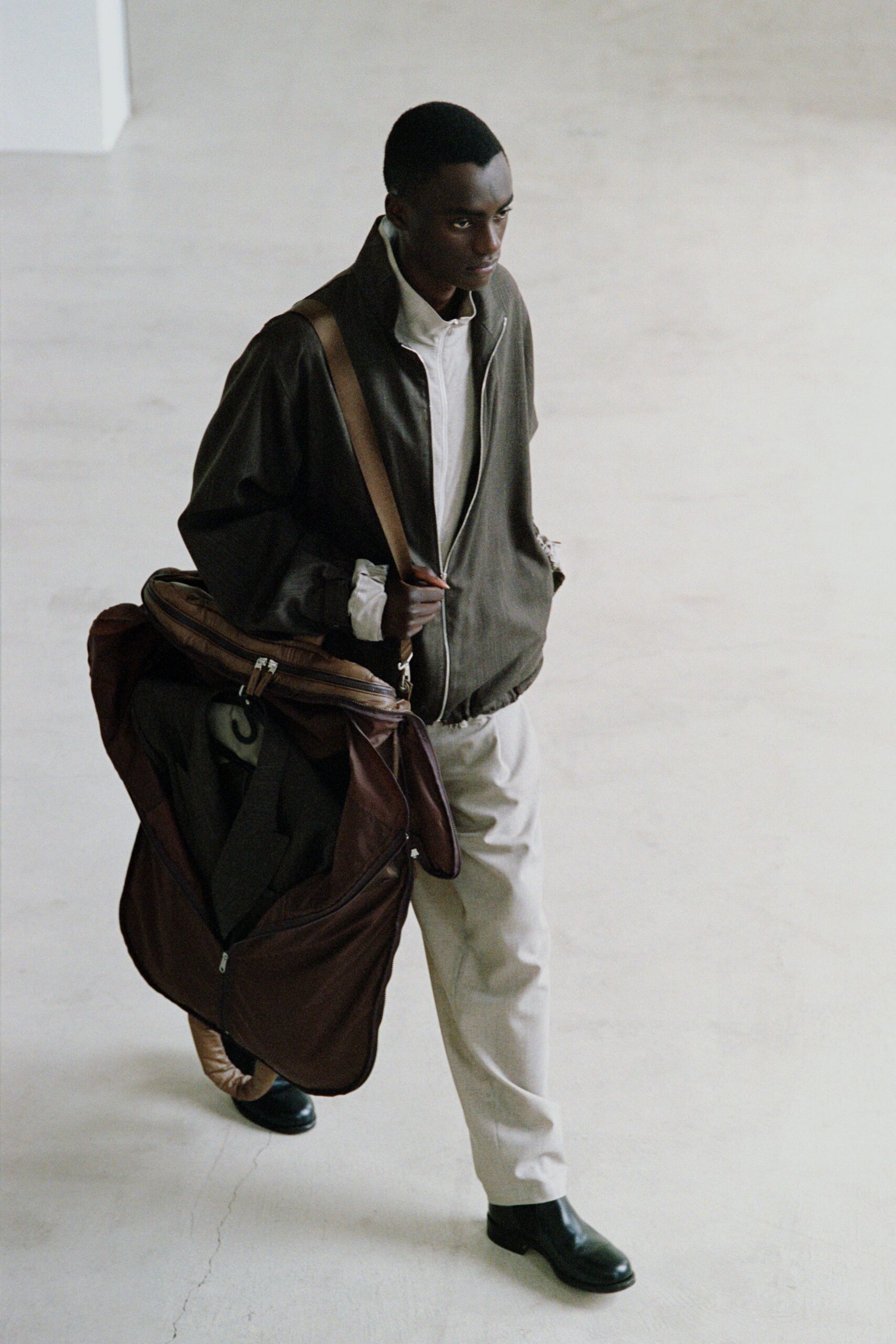 brown jacket with beige pants