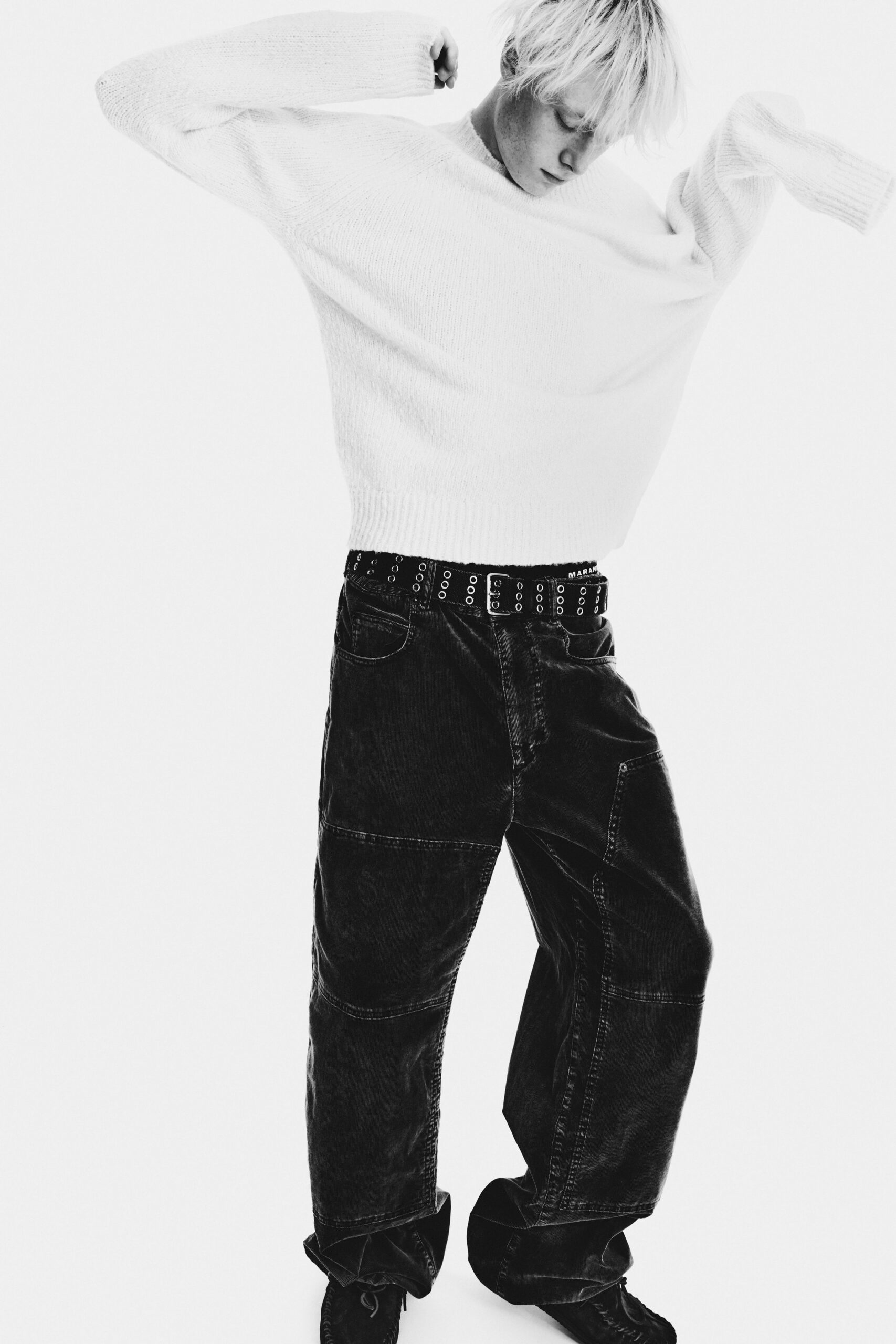 oversized white sweater with relaxed black pants