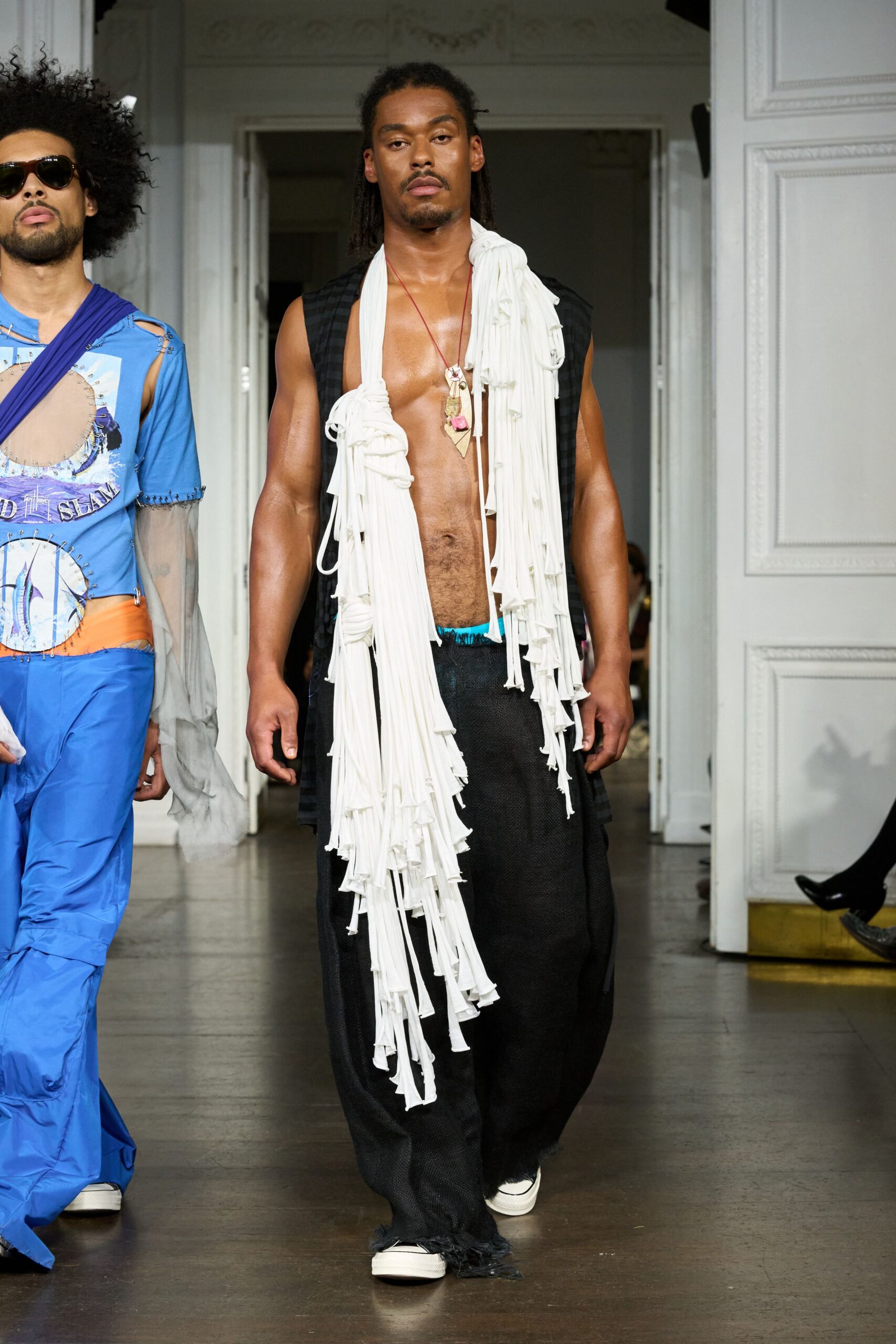 black relaxed pants with white fringed top