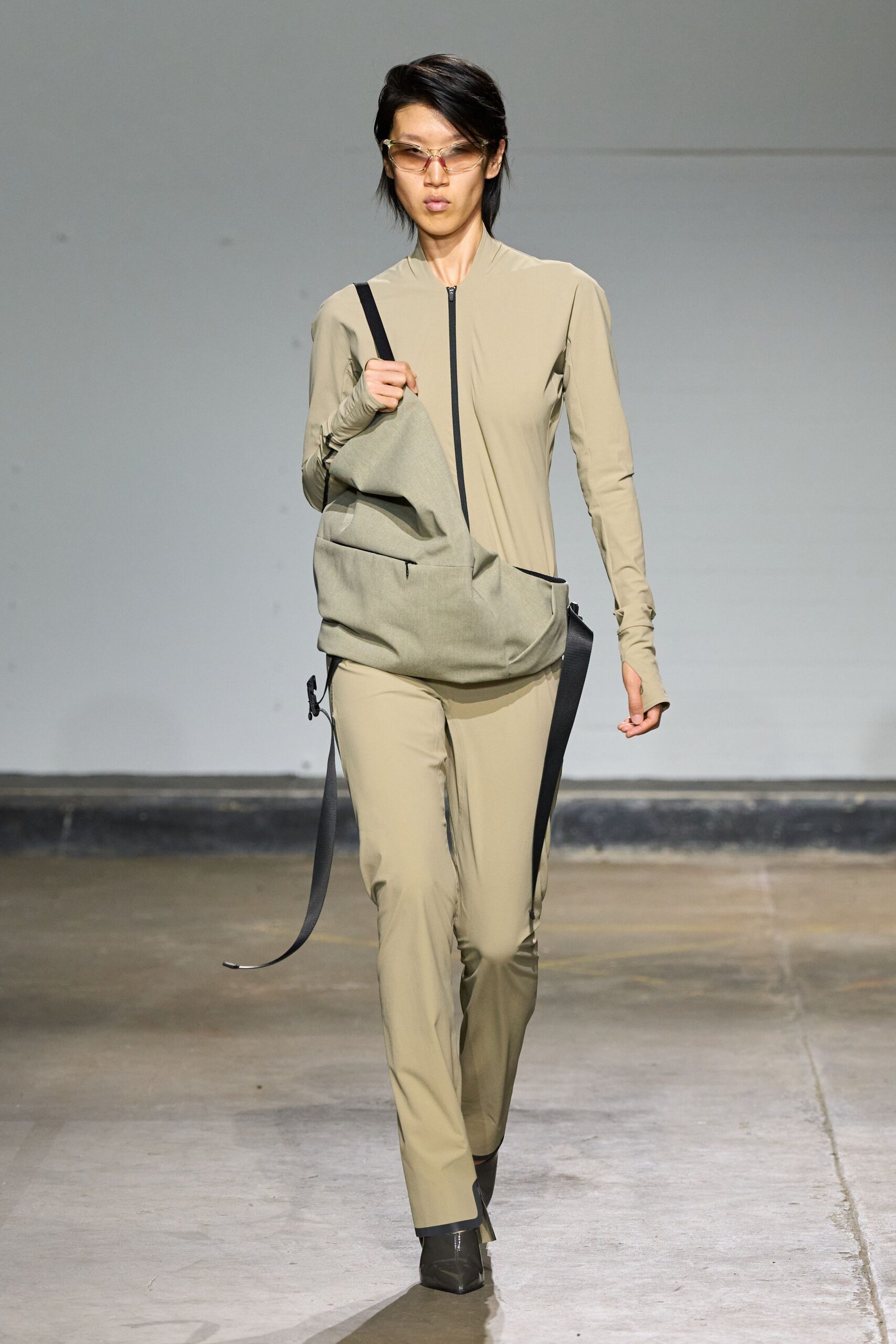 beige fitted jumpsuit with bag