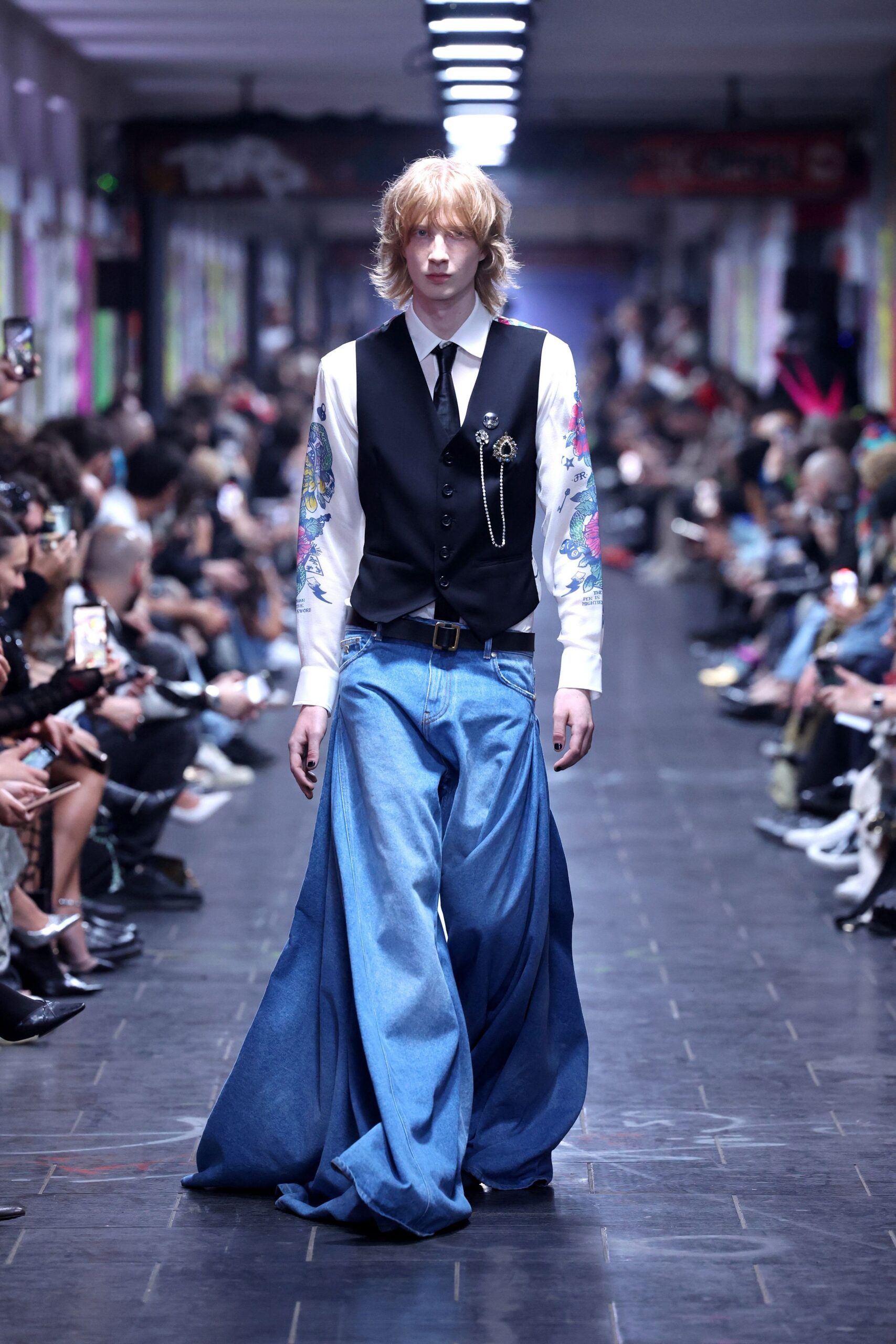 black vest white shirt blue pants