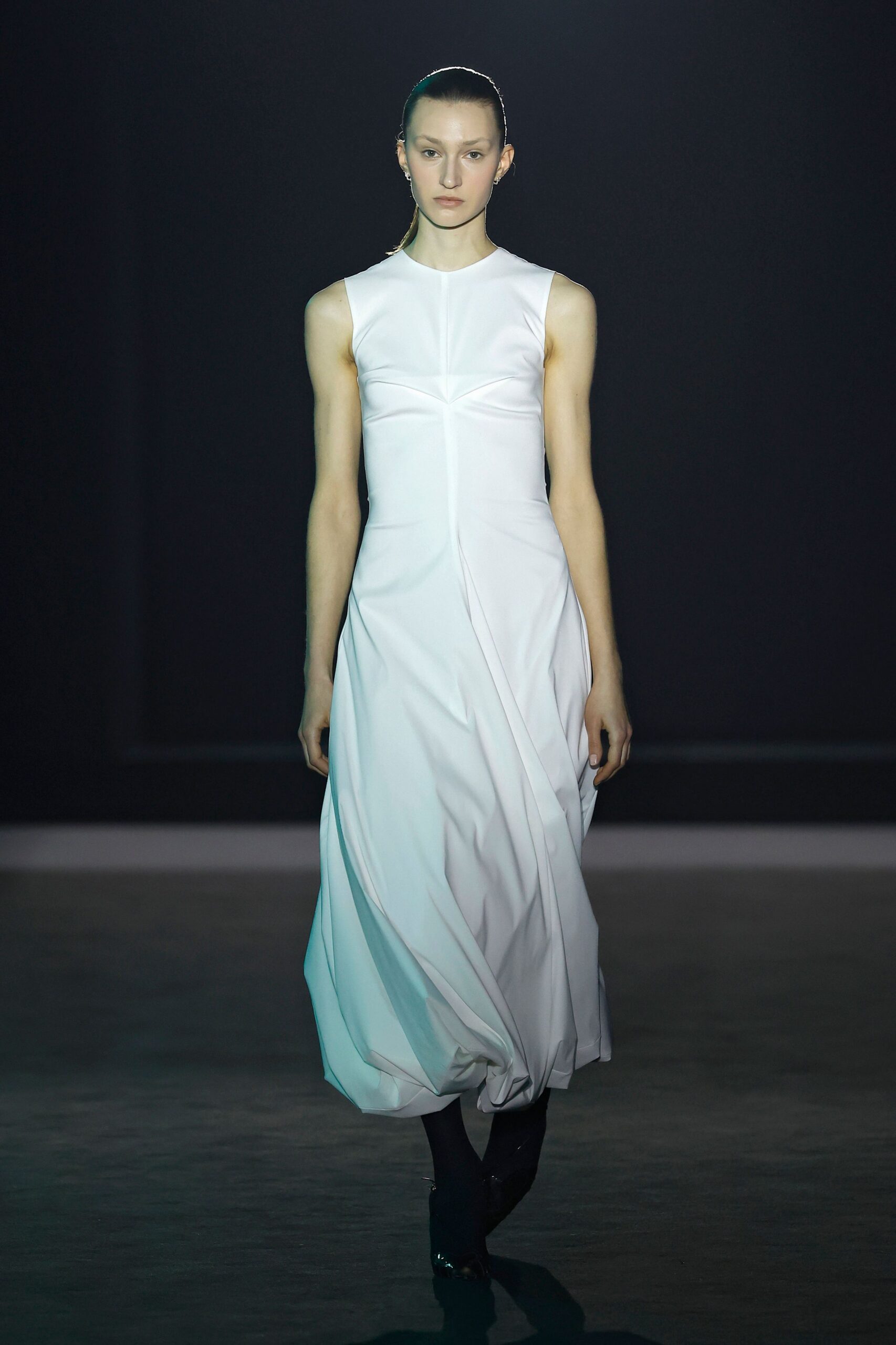 white silk sleeveless high-neck fitted draped flowing dress