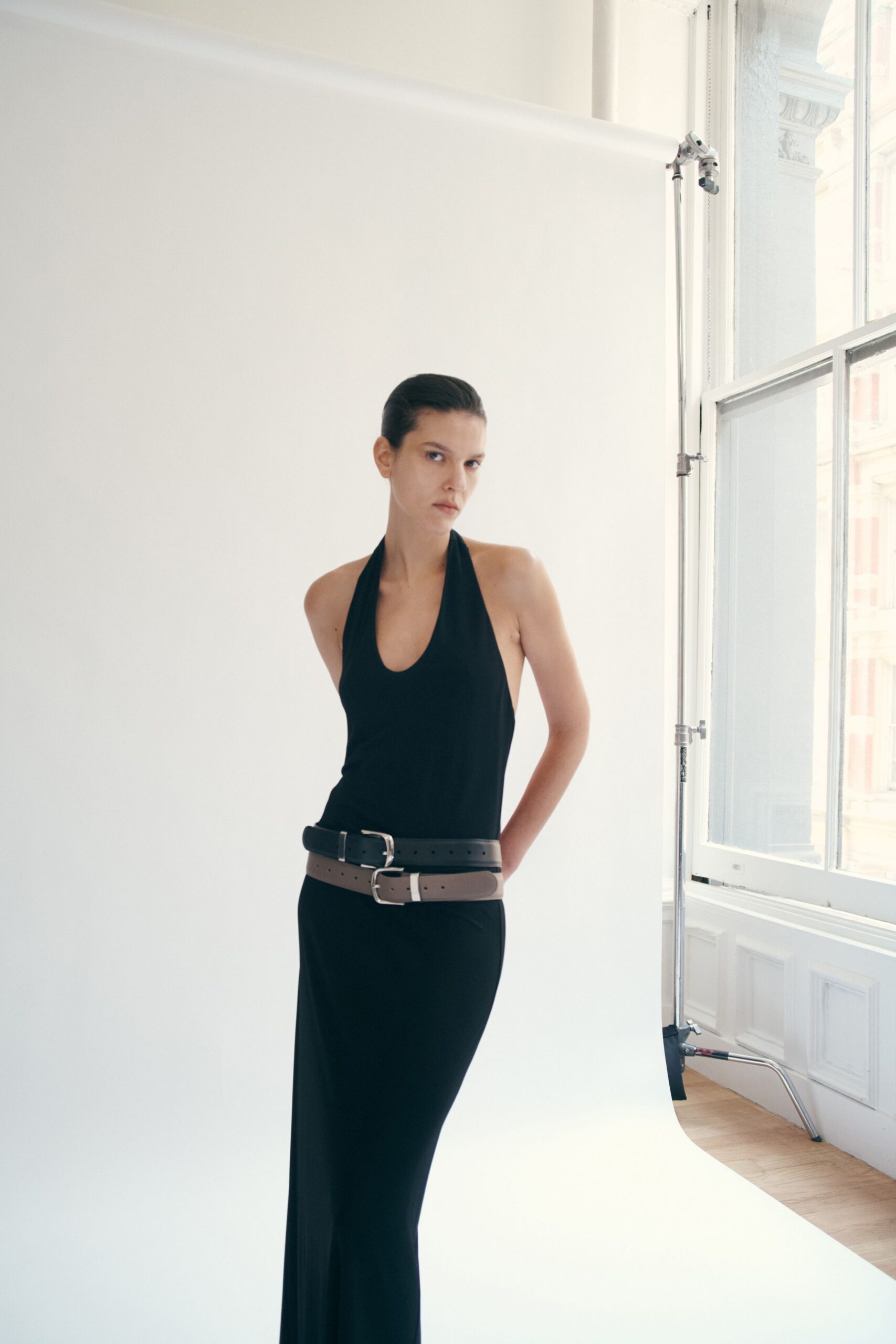 black fitted sleeveless gown with belt