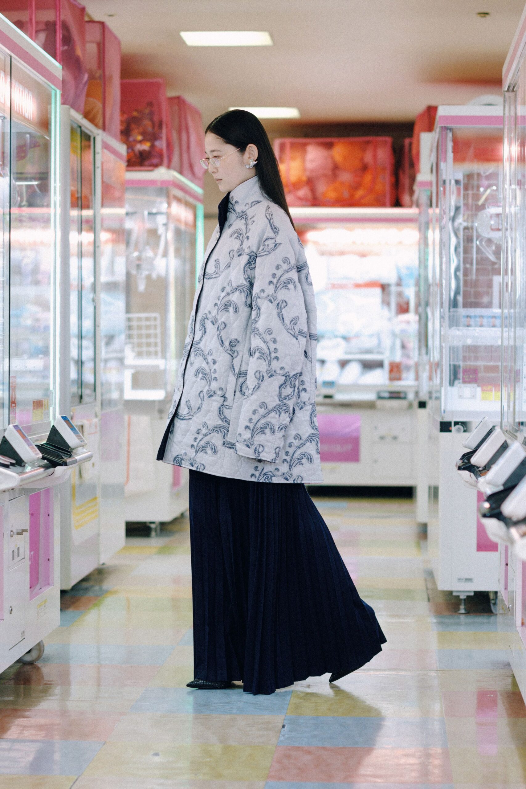 embroidered white coat with black pants