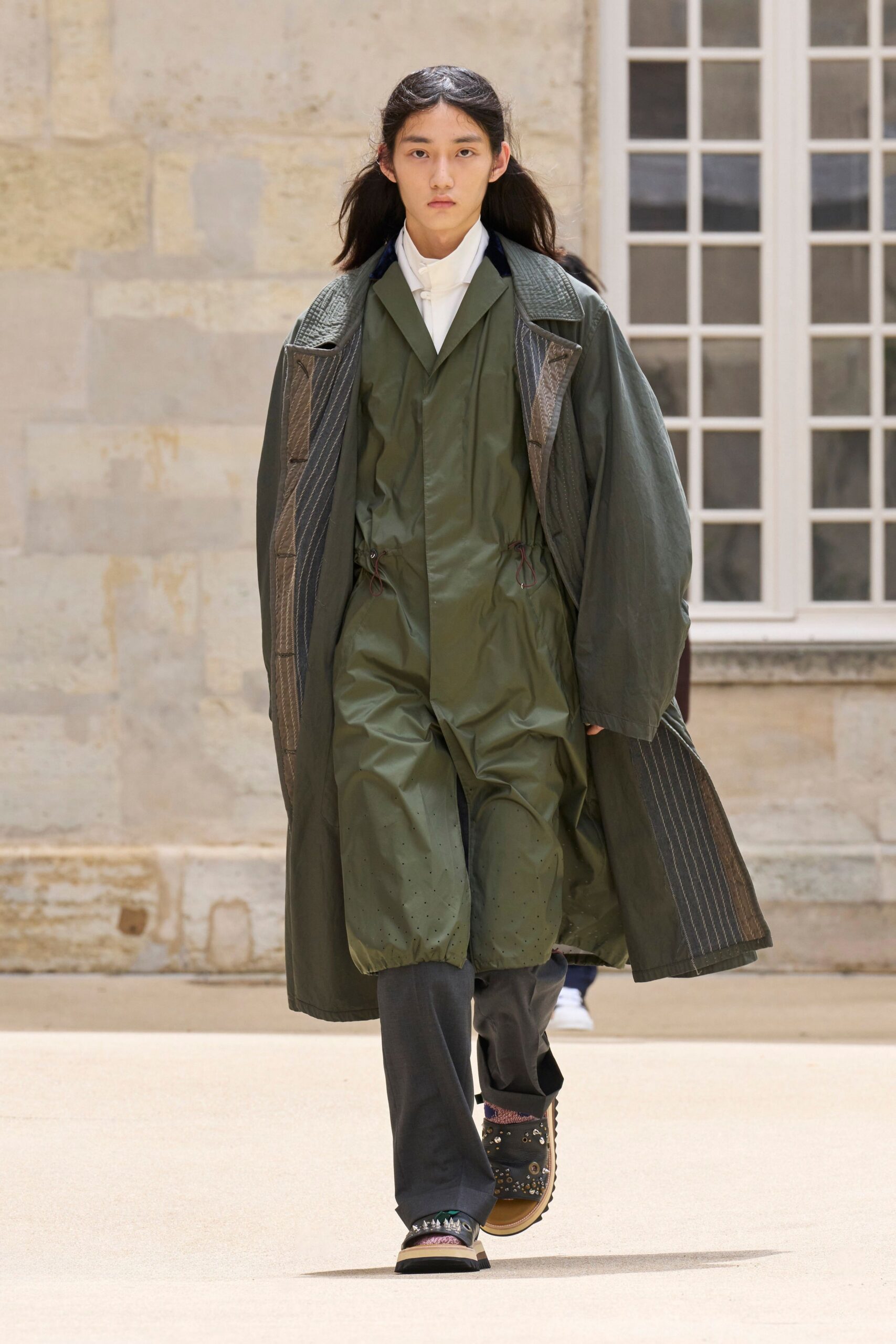green coat jumpsuit black pants