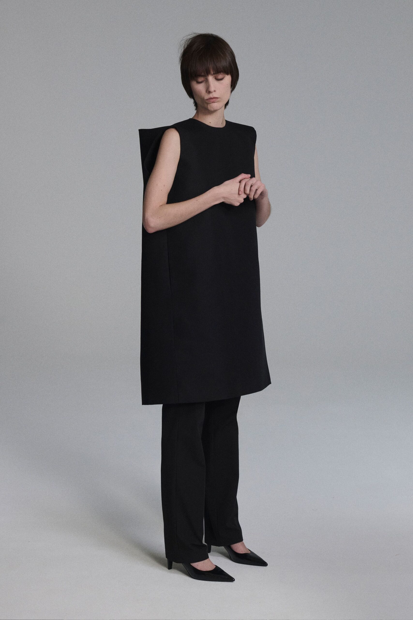 black relaxed mini dress with fitted pants