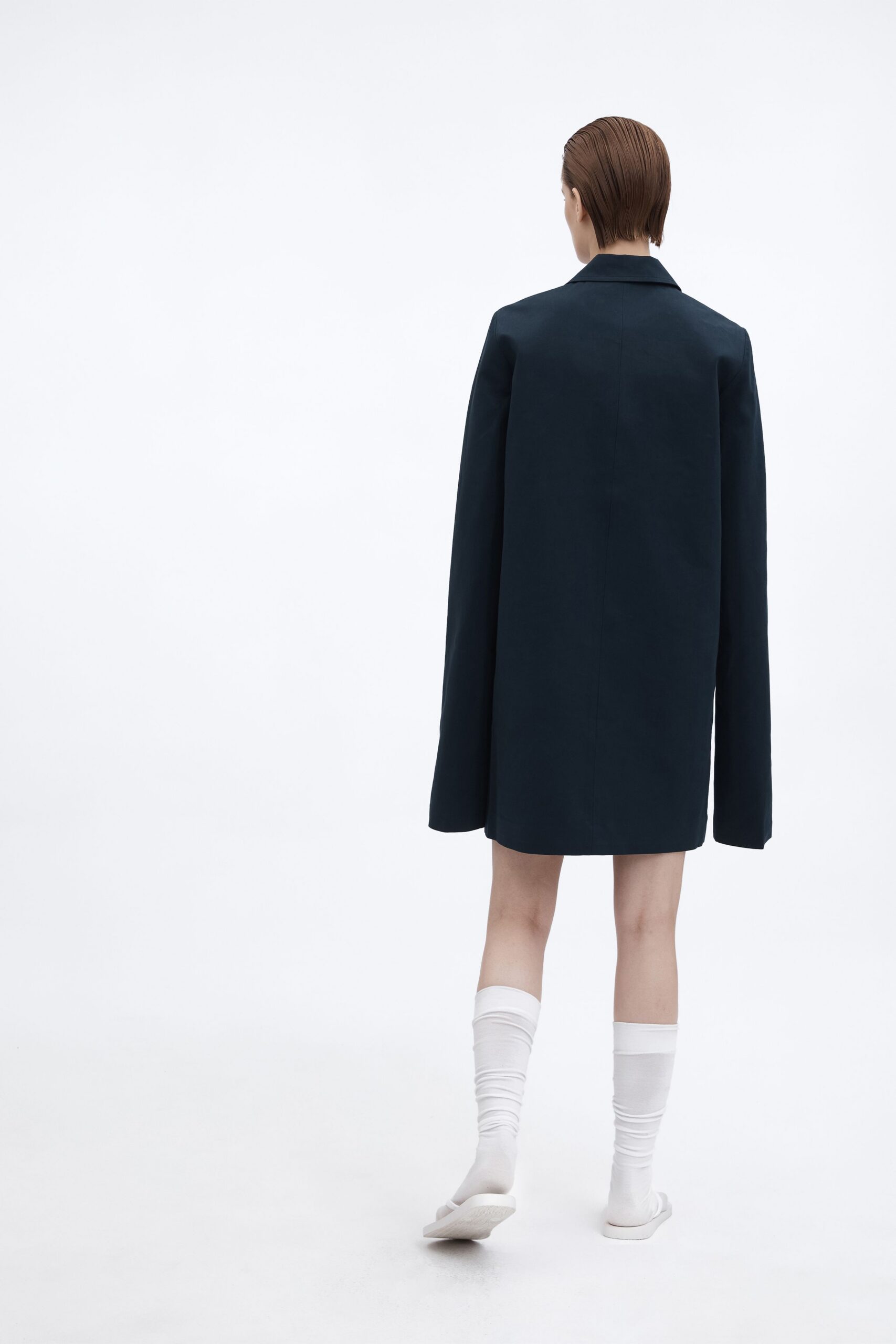 black oversized coat with white shoes