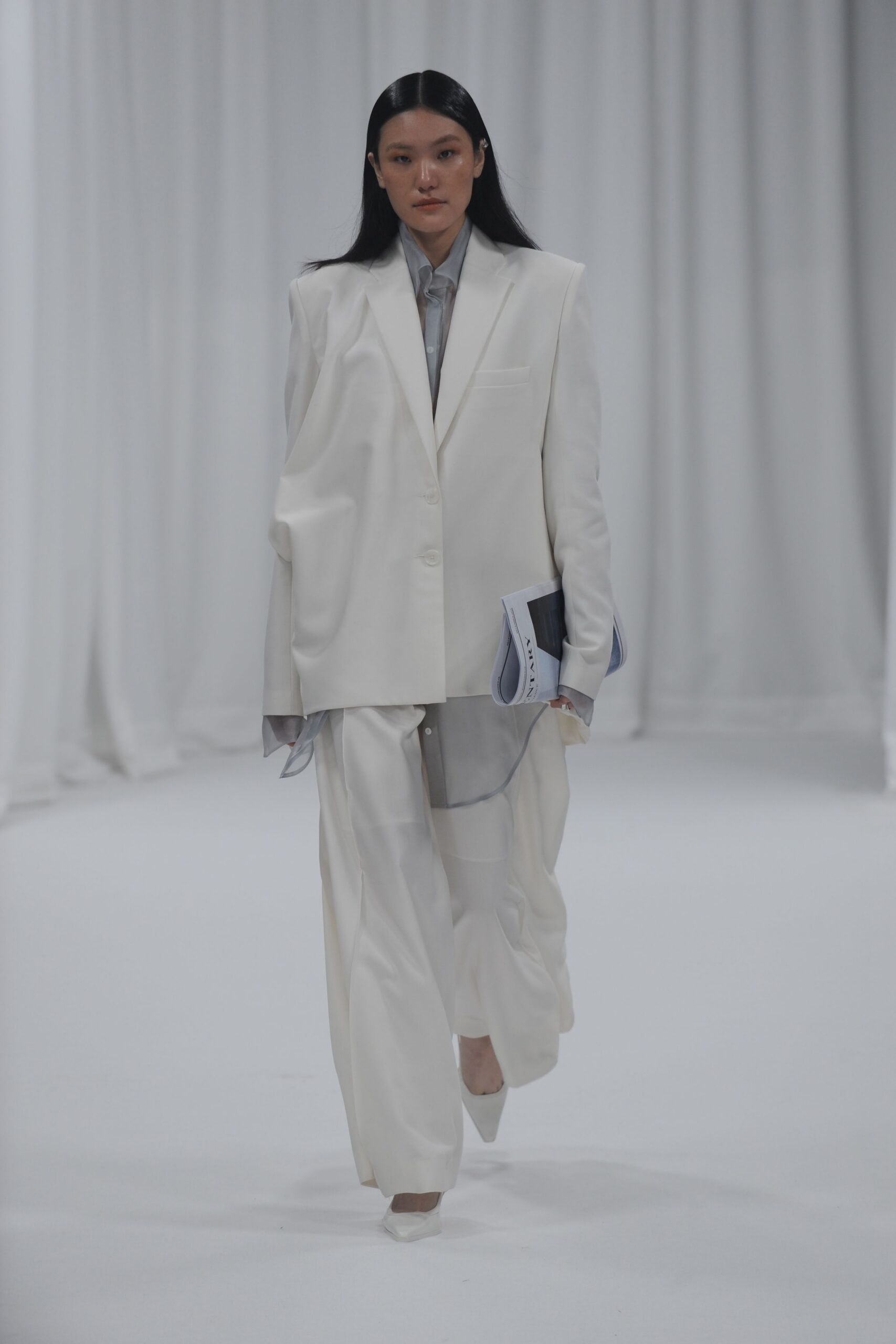 white relaxed suit with gray shirt