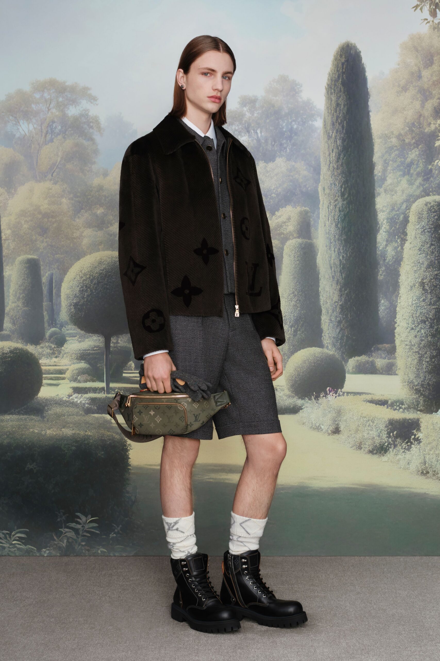black faux-fur jacket with gray shirt and tailored shorts