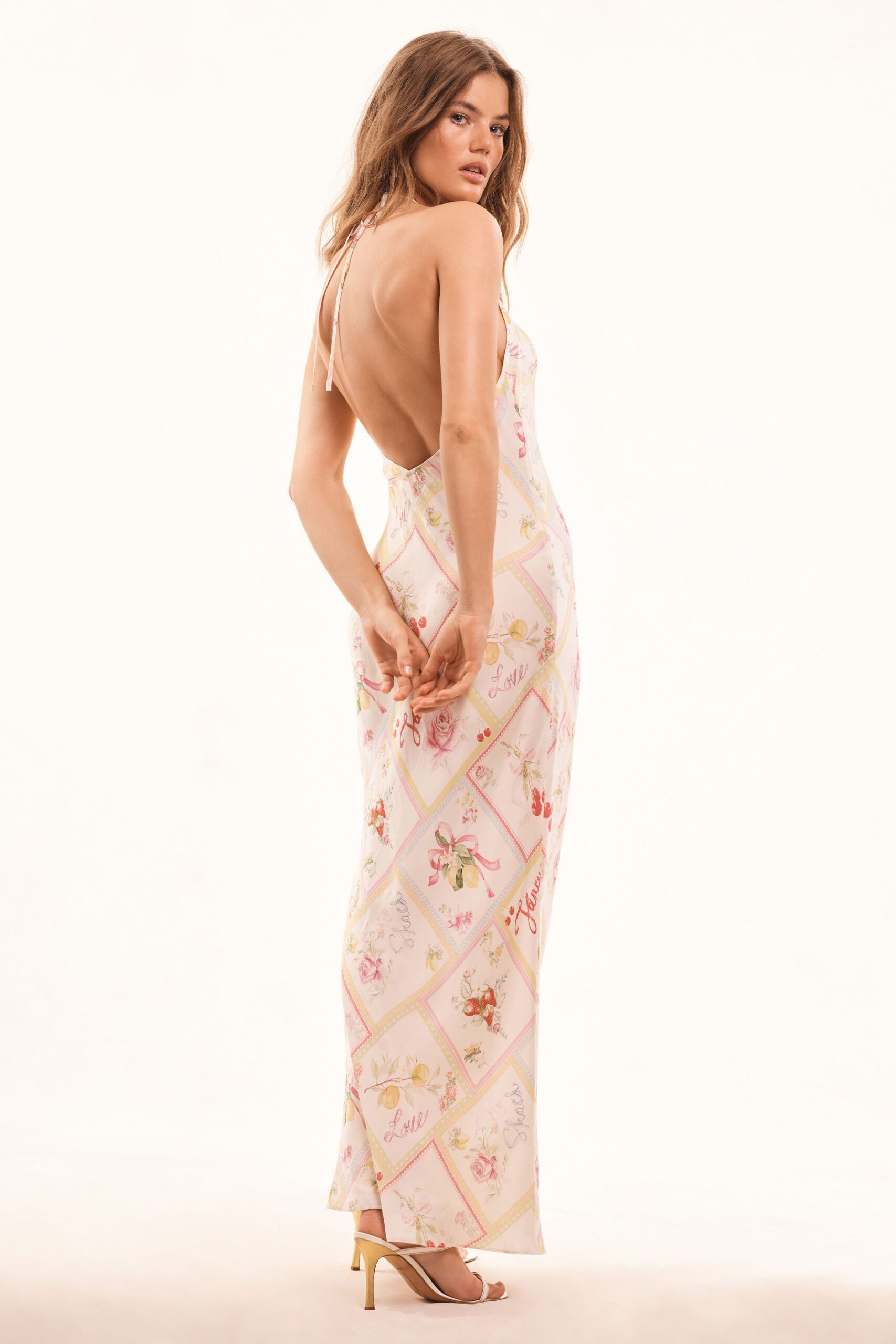 pink floral backless gown with heels