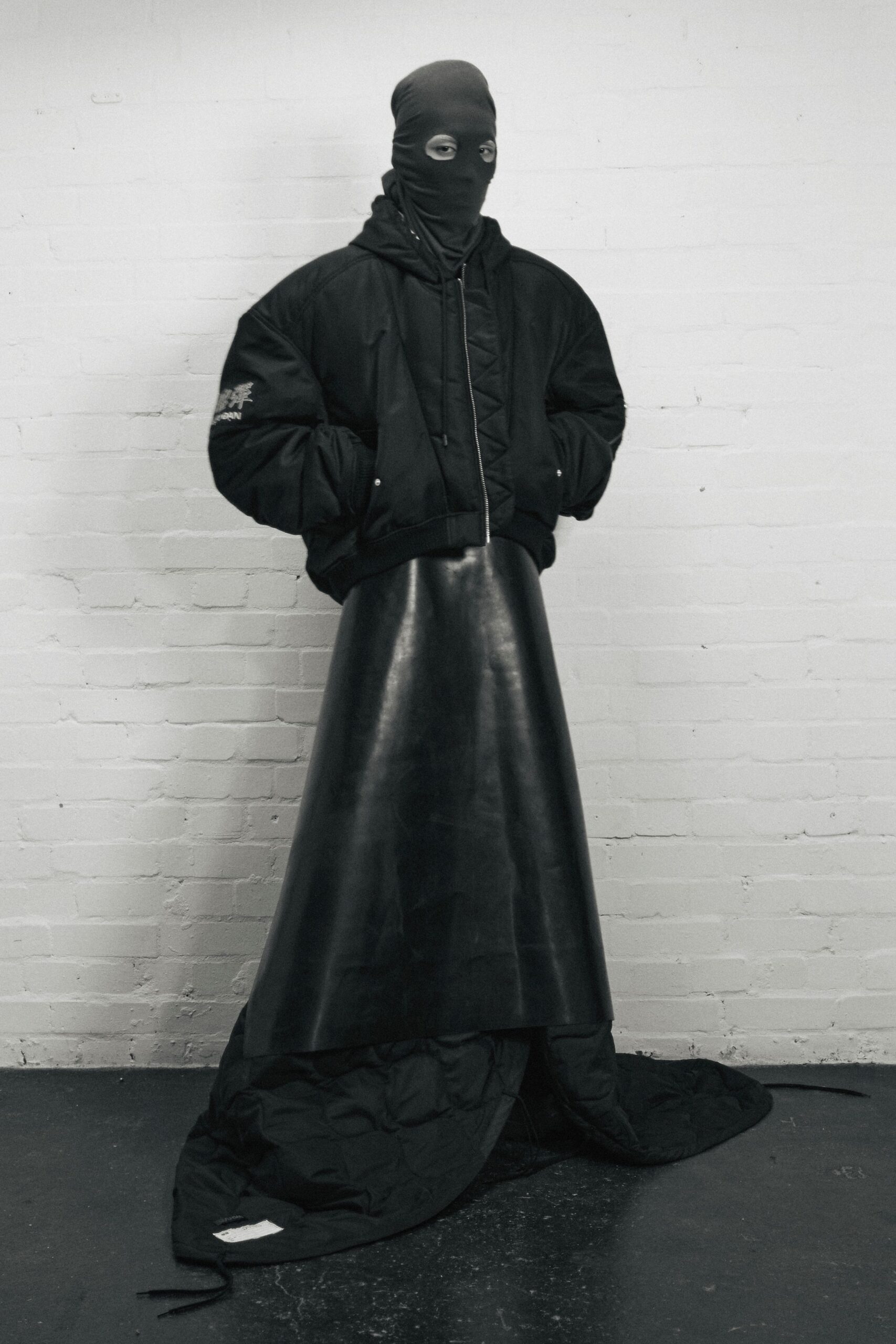 black oversized jacket and leather skirt
