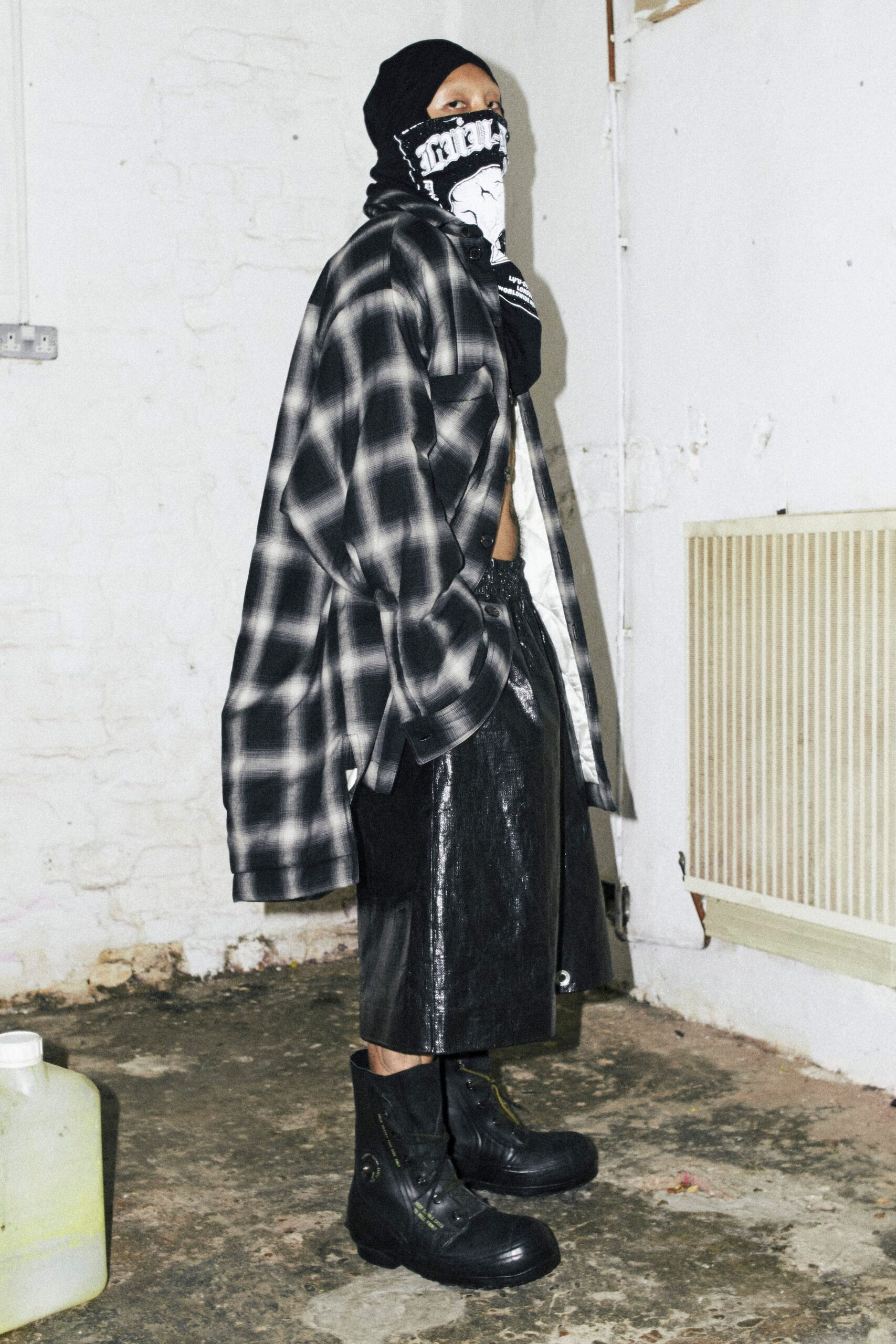 oversized black and white shirt with leather skirt