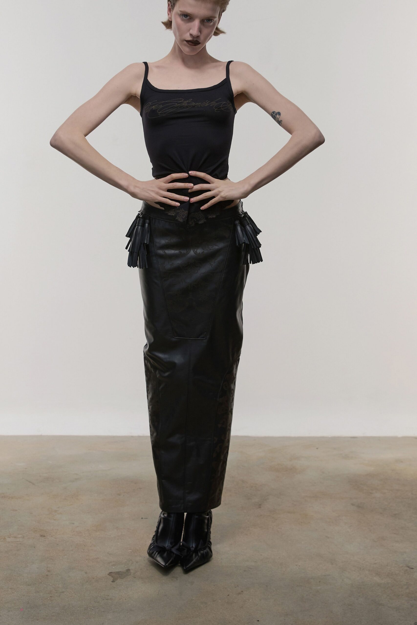 black fitted top and midi skirt