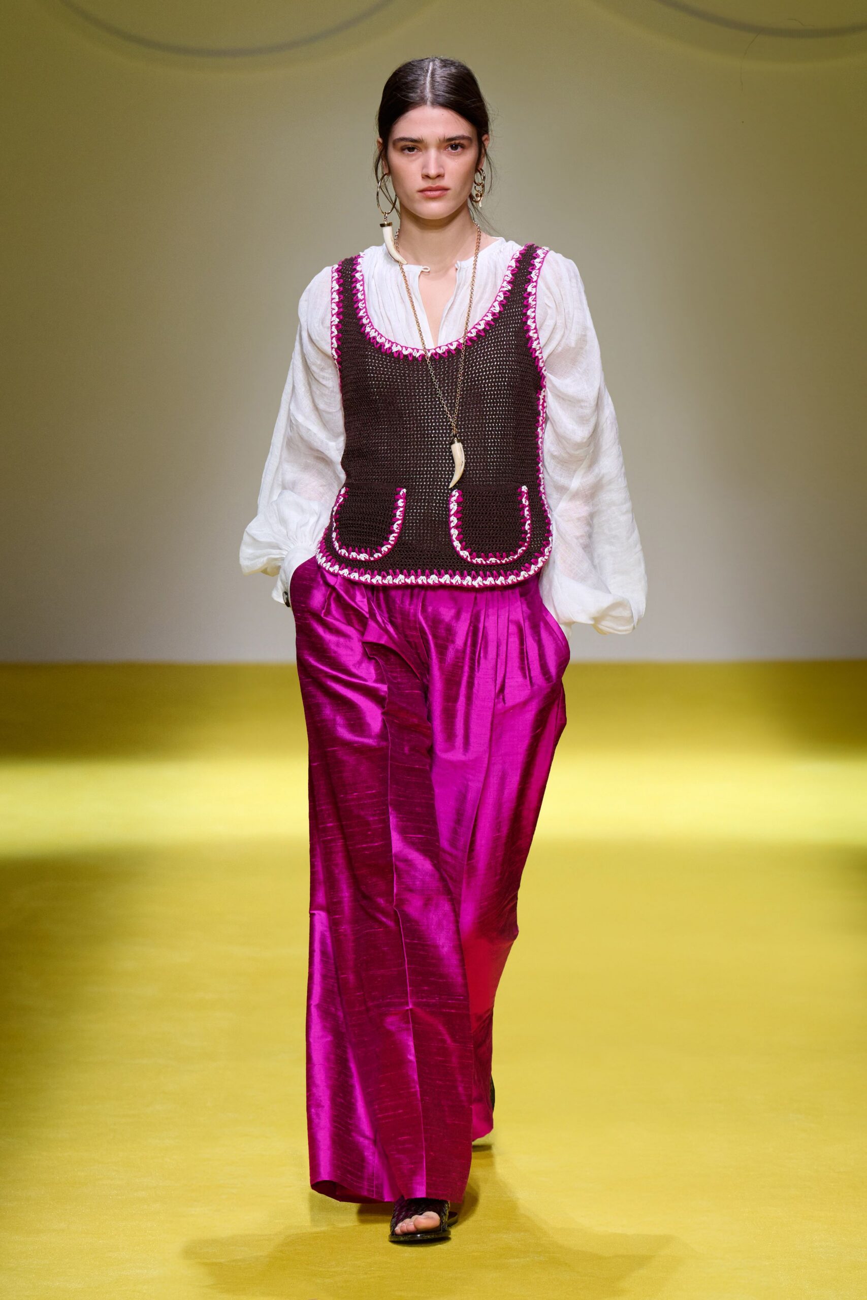 white cotton top with brown vest and pink pants