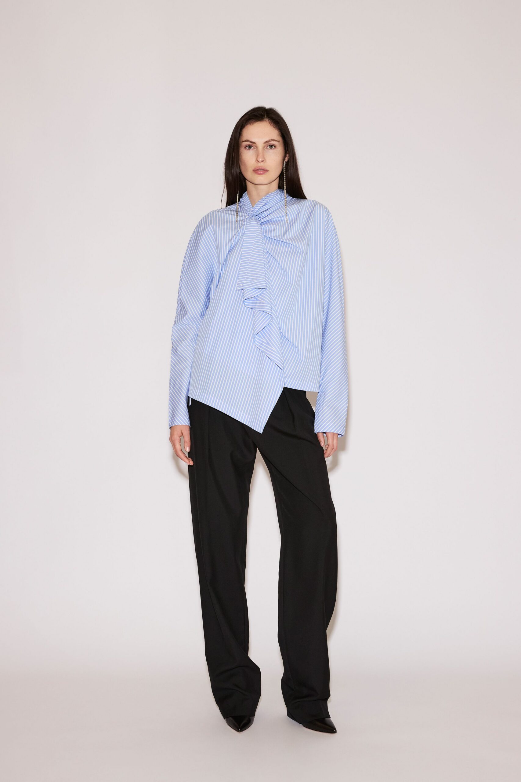 blue and white striped shirt with black pants