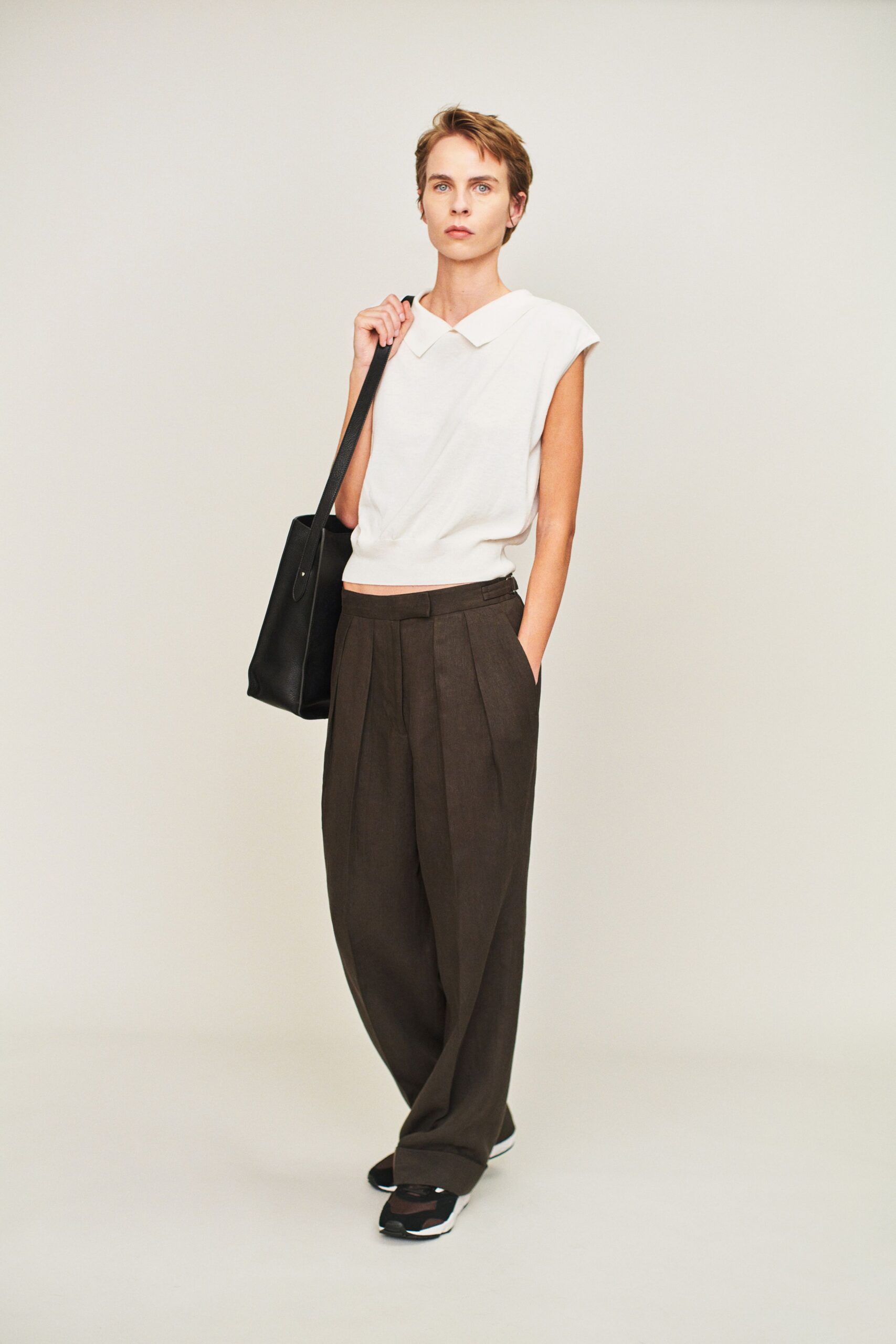 white relaxed top with brown pants