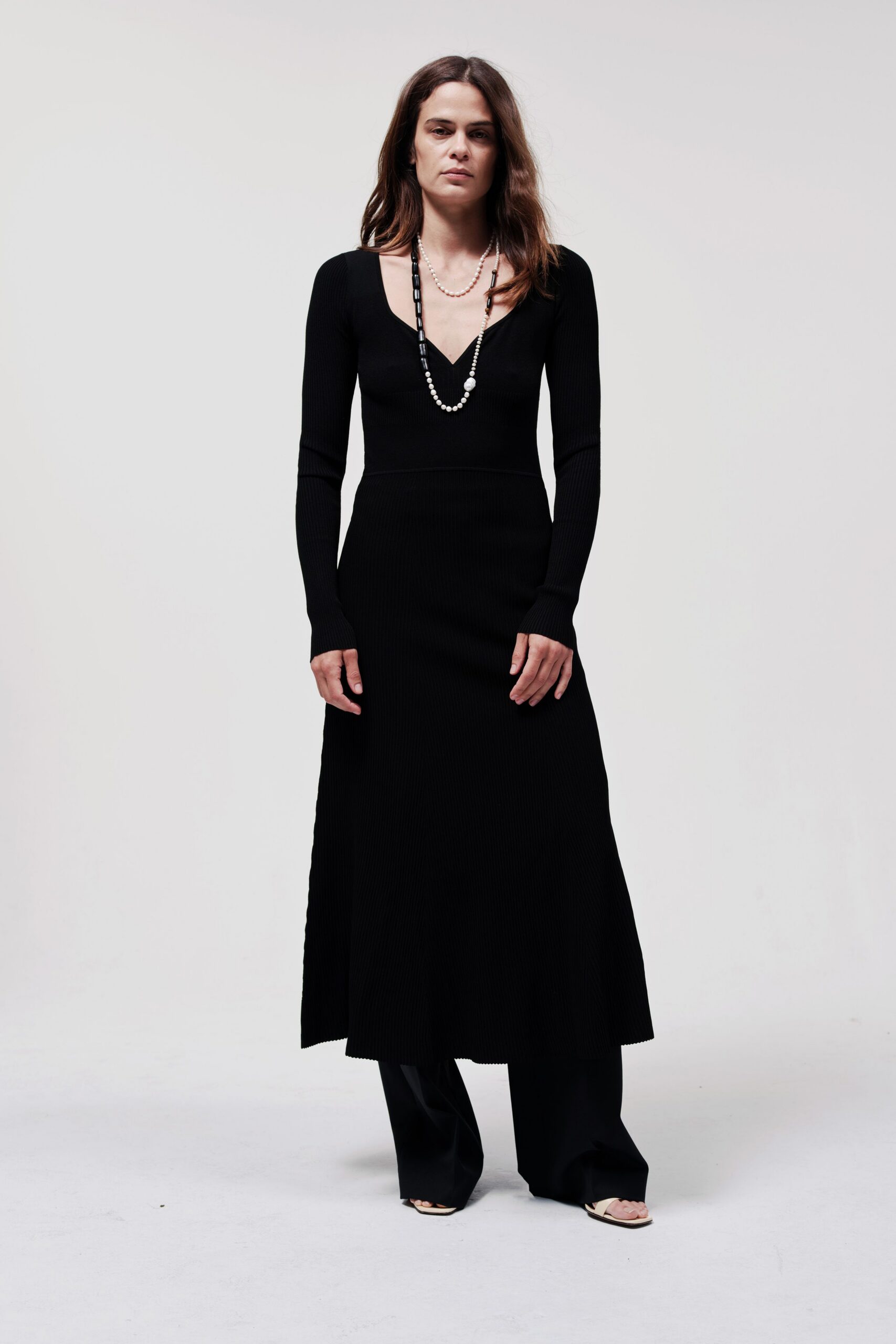 black fitted midi dress with relaxed pants