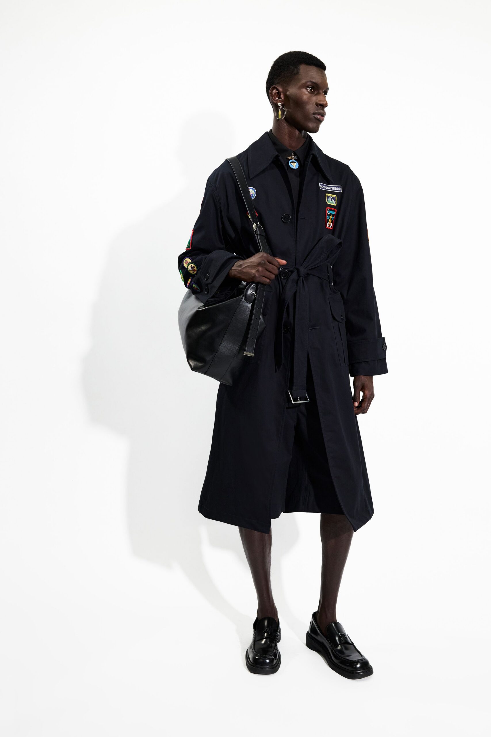 black trench coat with leather shoes