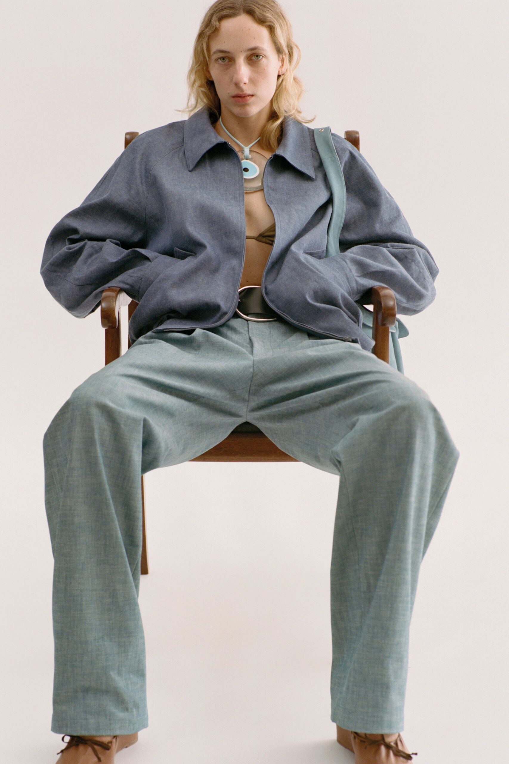 blue relaxed jacket beige fitted top