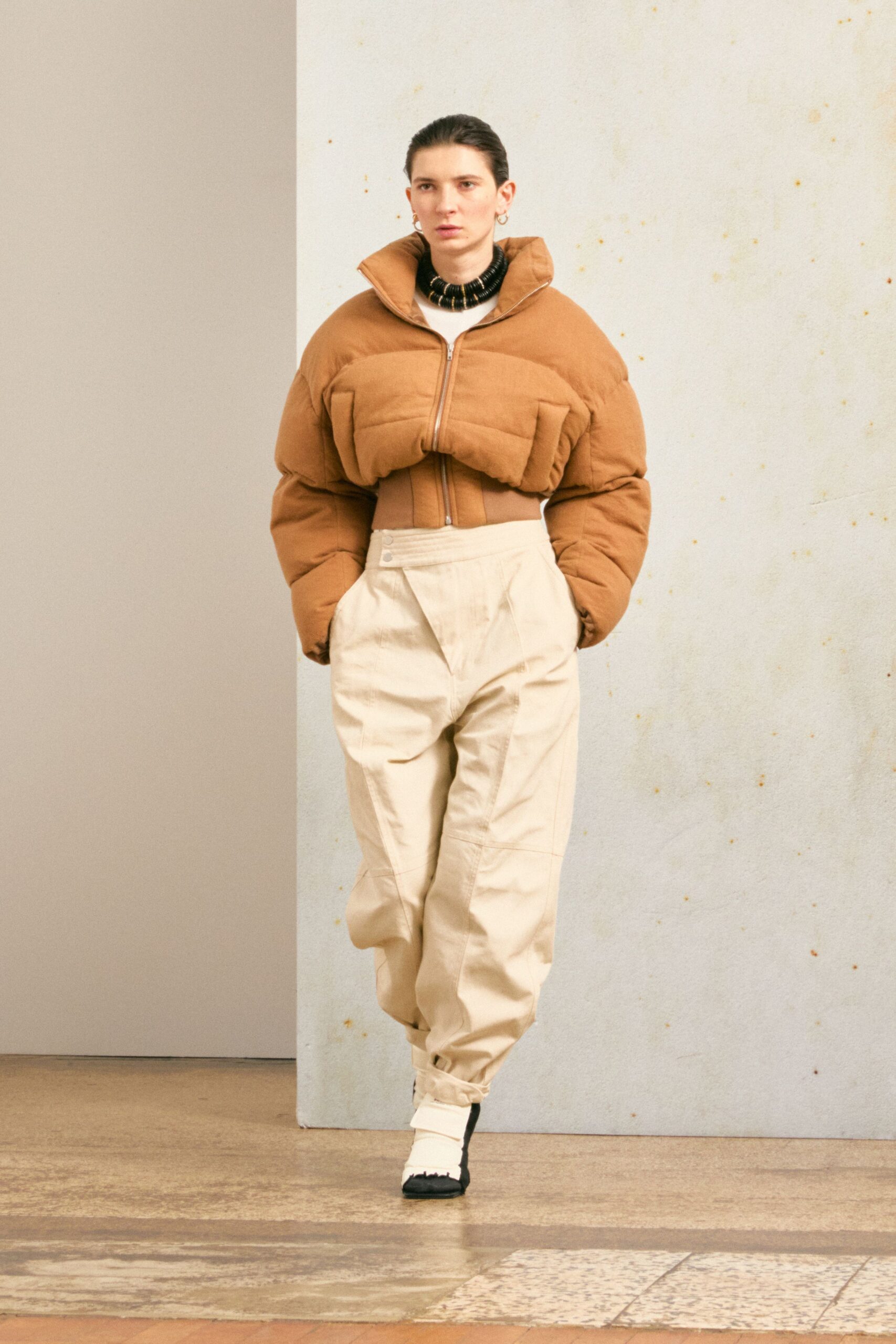 brown fitted jacket beige relaxed pants