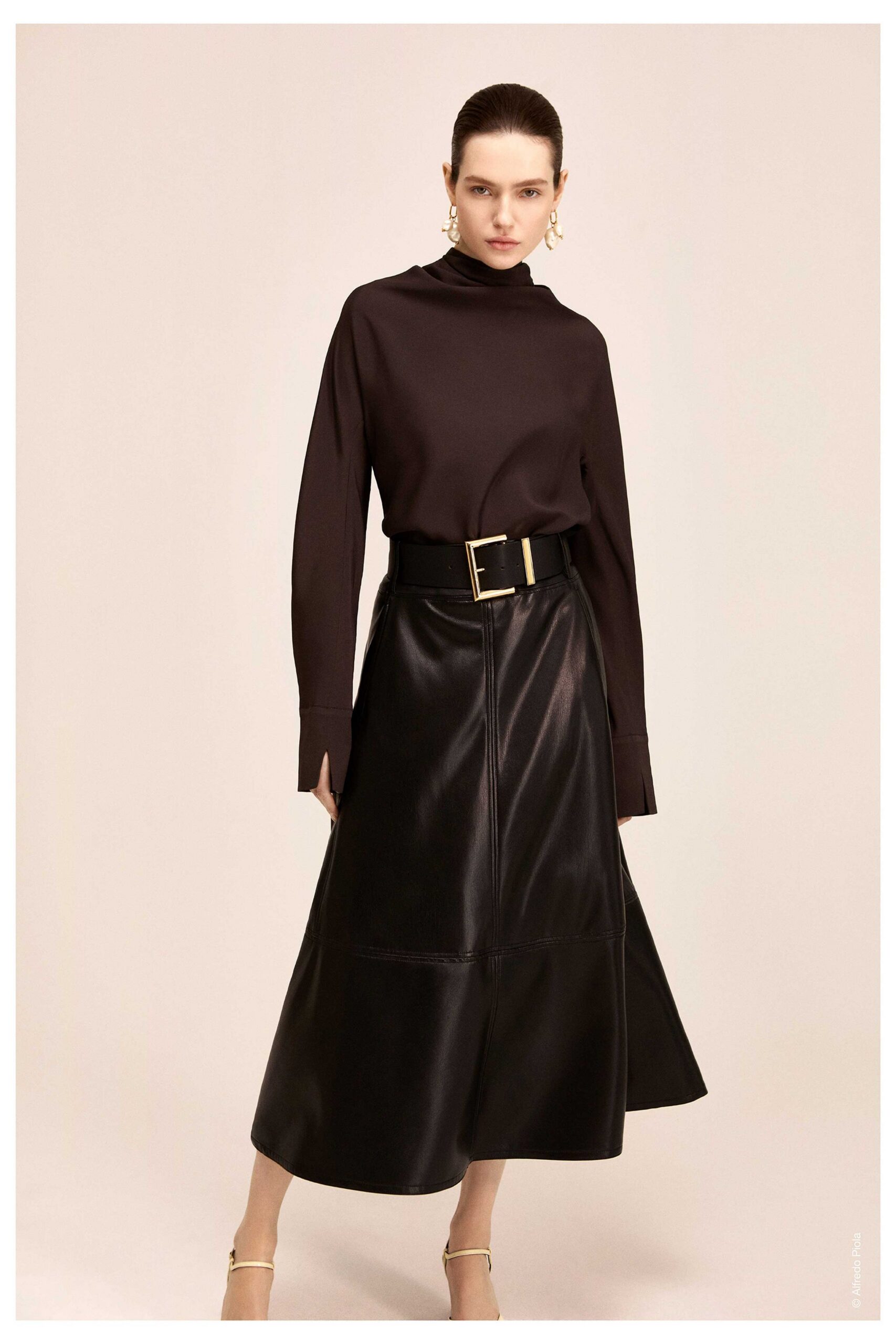 black fitted top and midi skirt