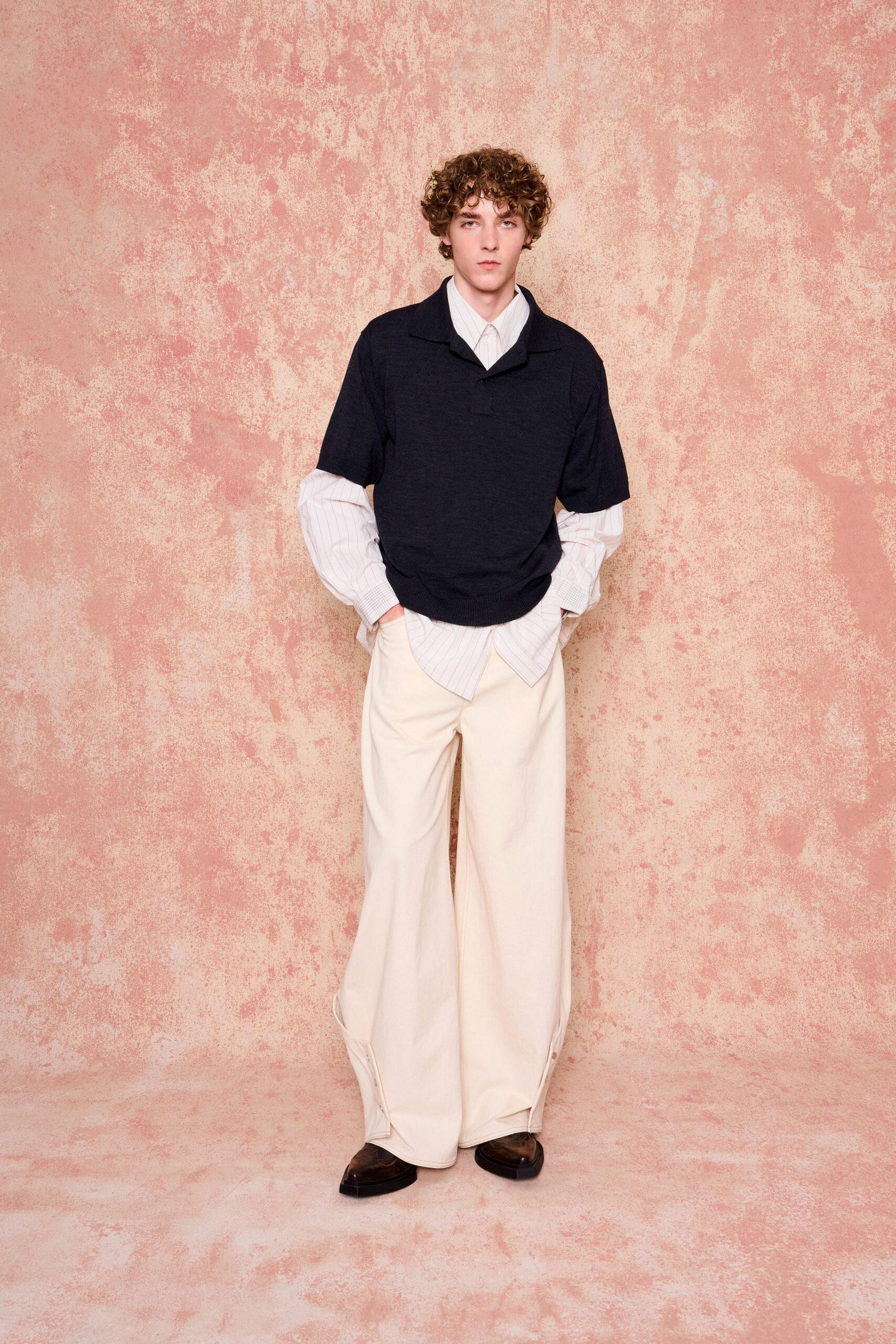 navy top with white shirt and beige pants