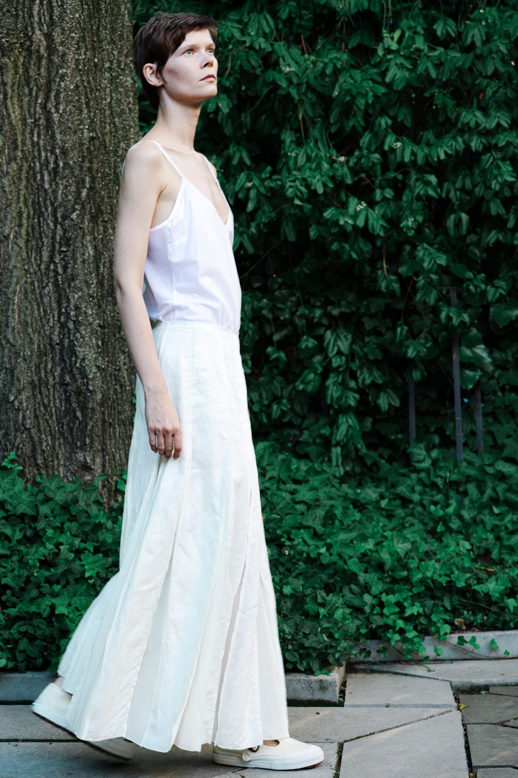white silk top and pleated skirt