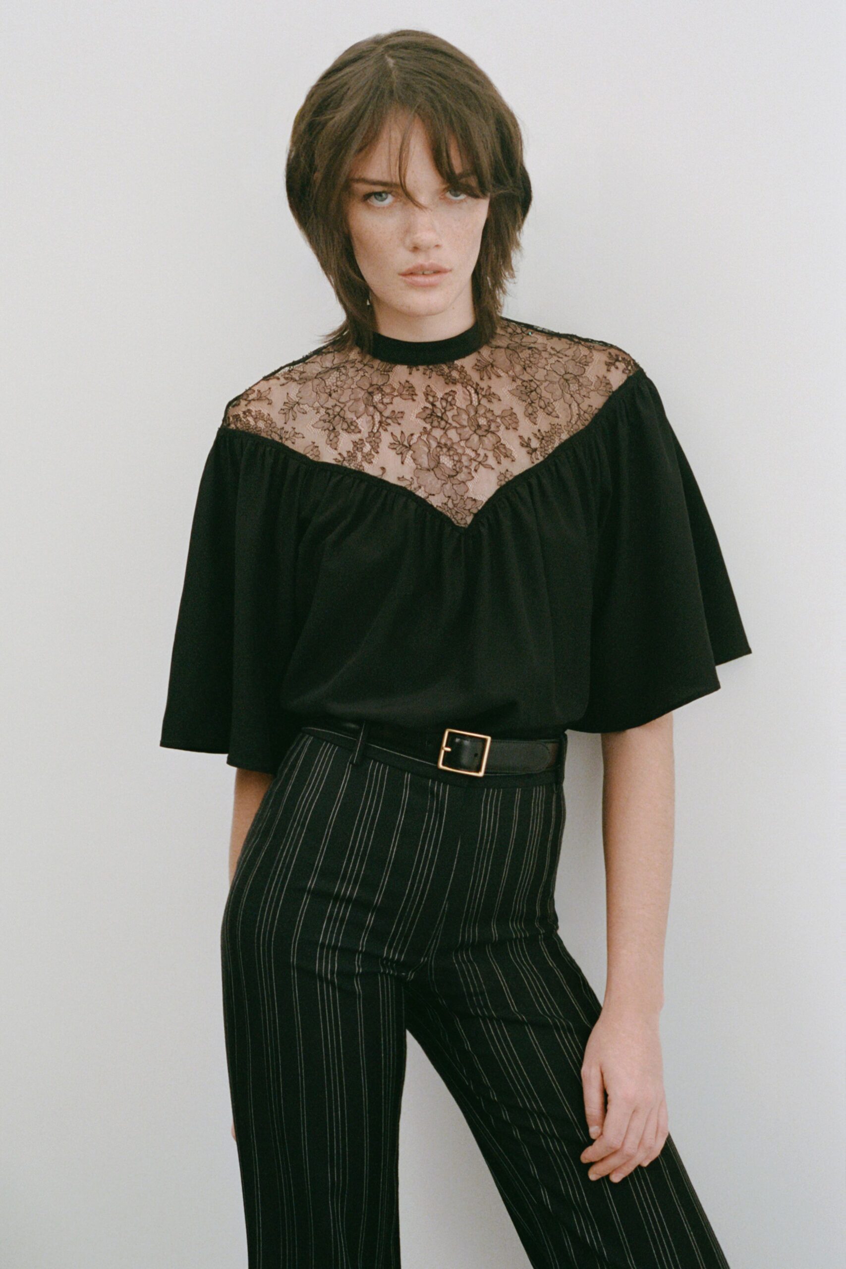 black lace top with striped pants
