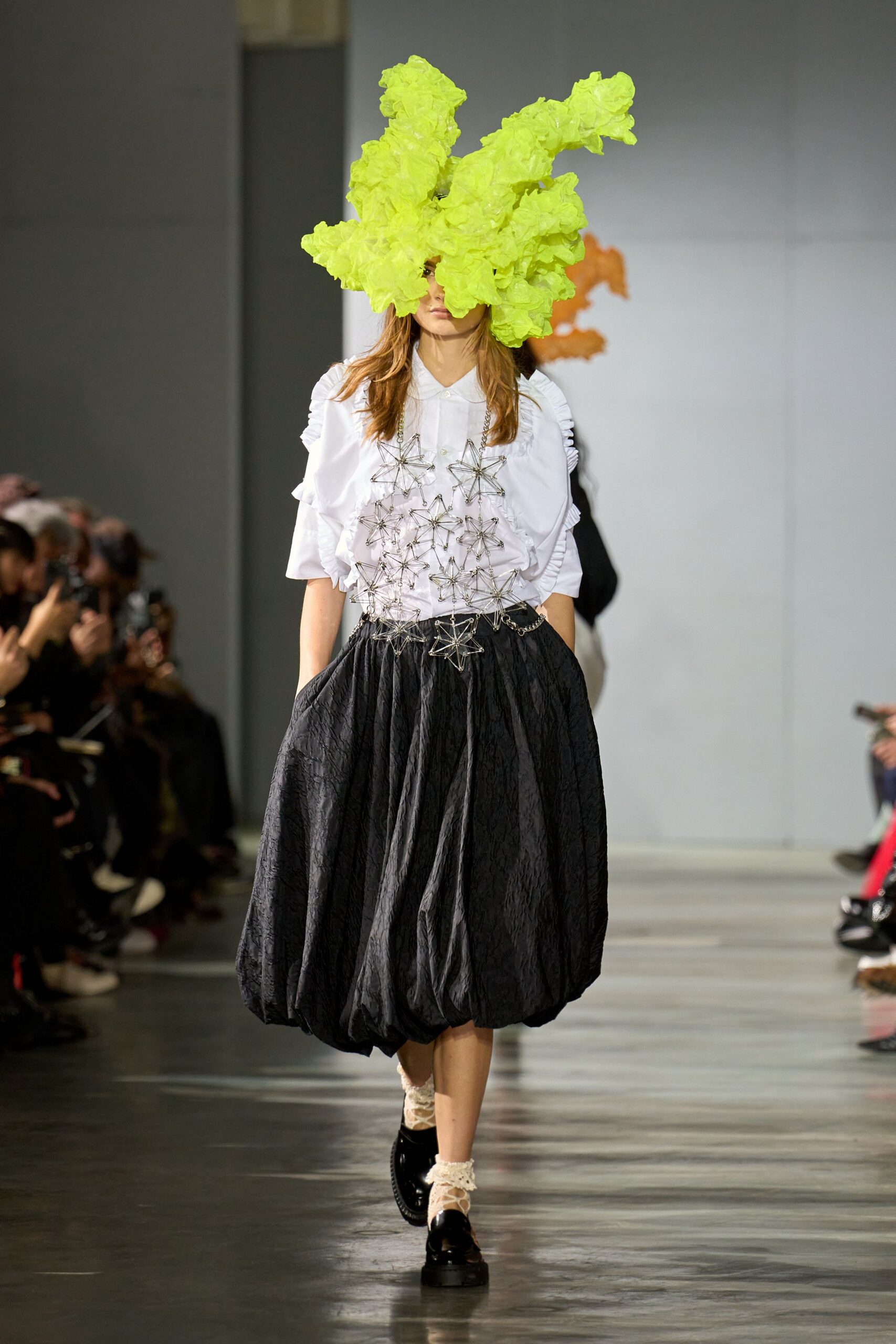 white shirt black pleated skirt