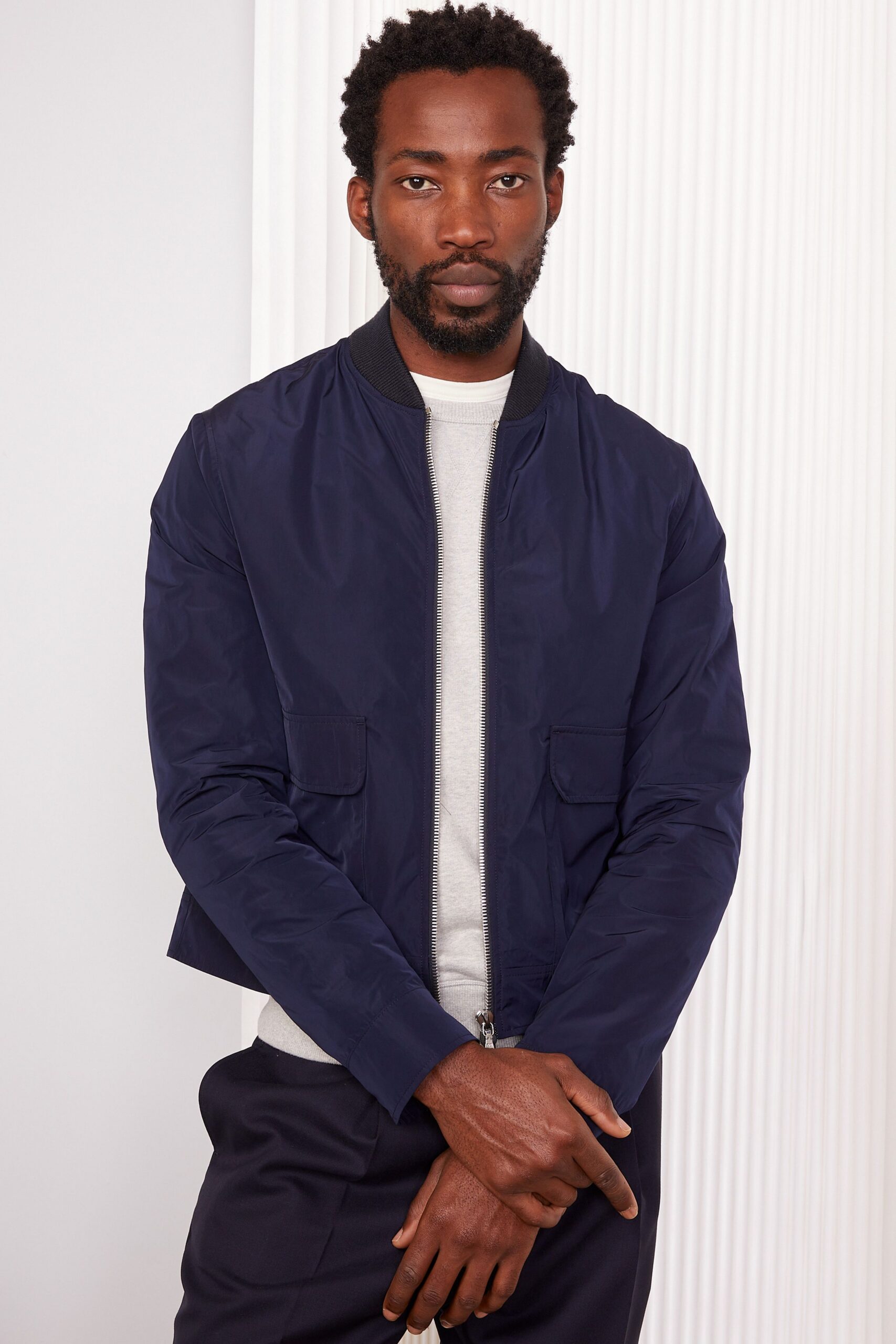 blue cotton long-sleeve collared fitted zippered pockets jacket