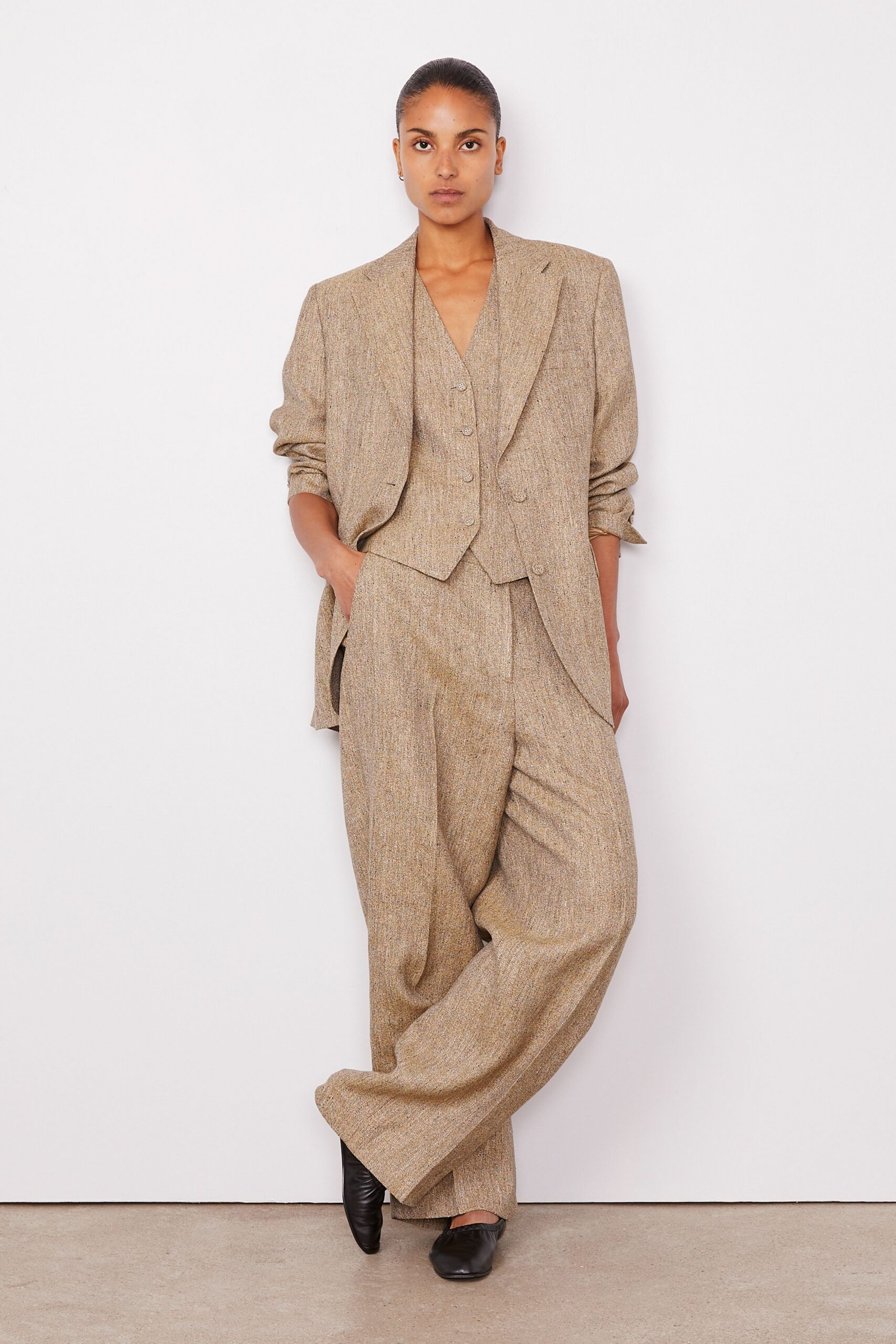 beige wool sleeveless fitted buttoned vest