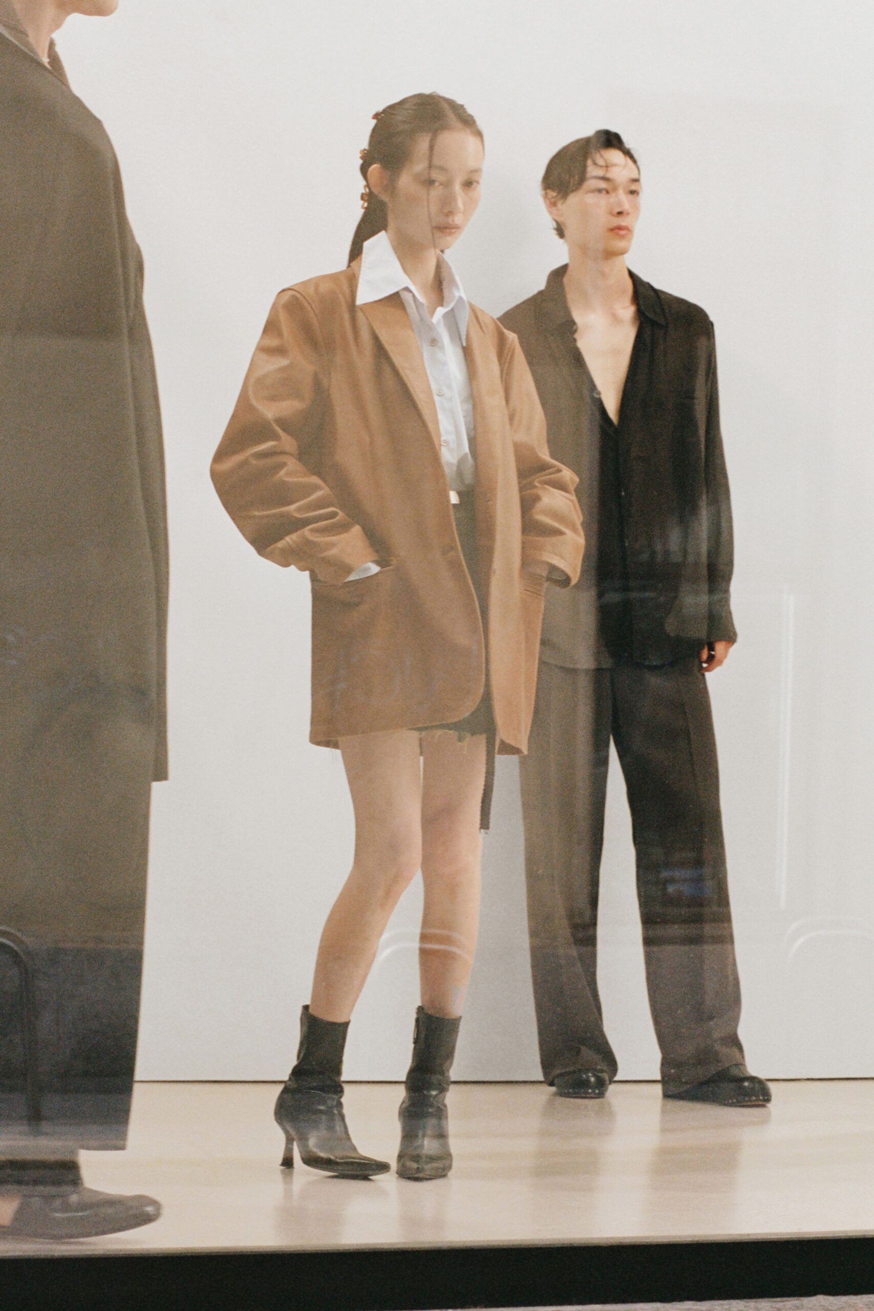 brown jacket white shirt black skirt