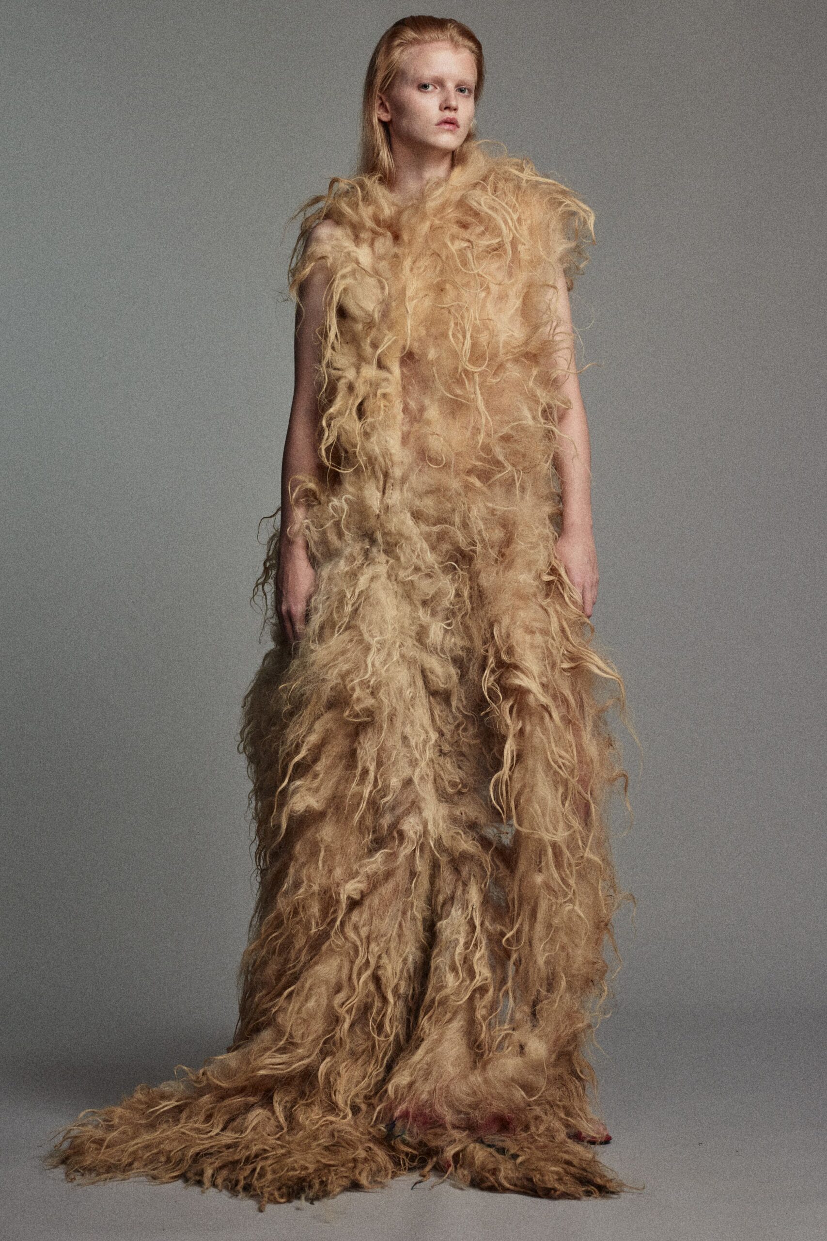 beige fringed fur gown