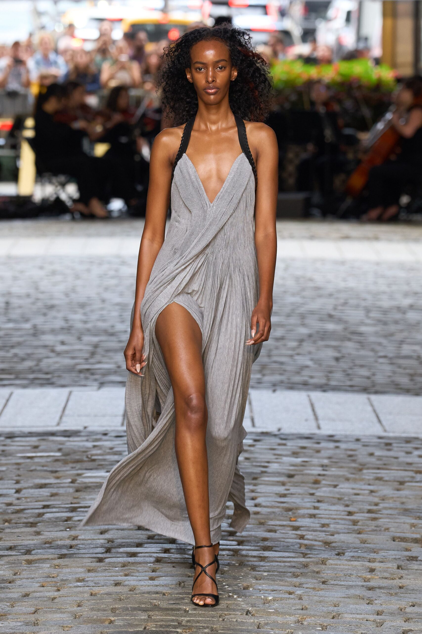 gray silk sleeveless v-neck fitted draped flowing gown