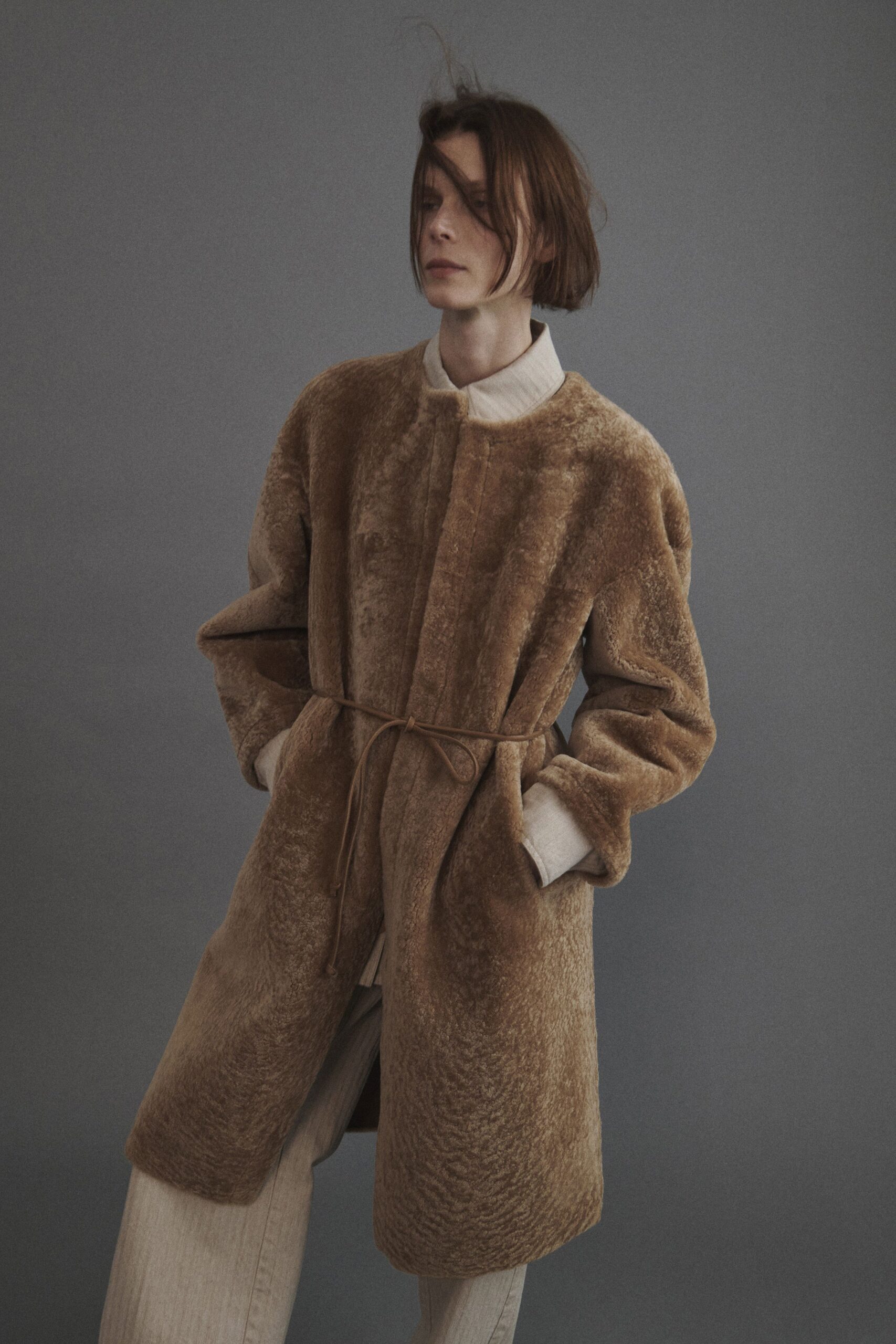 brown faux-fur coat and white shirt