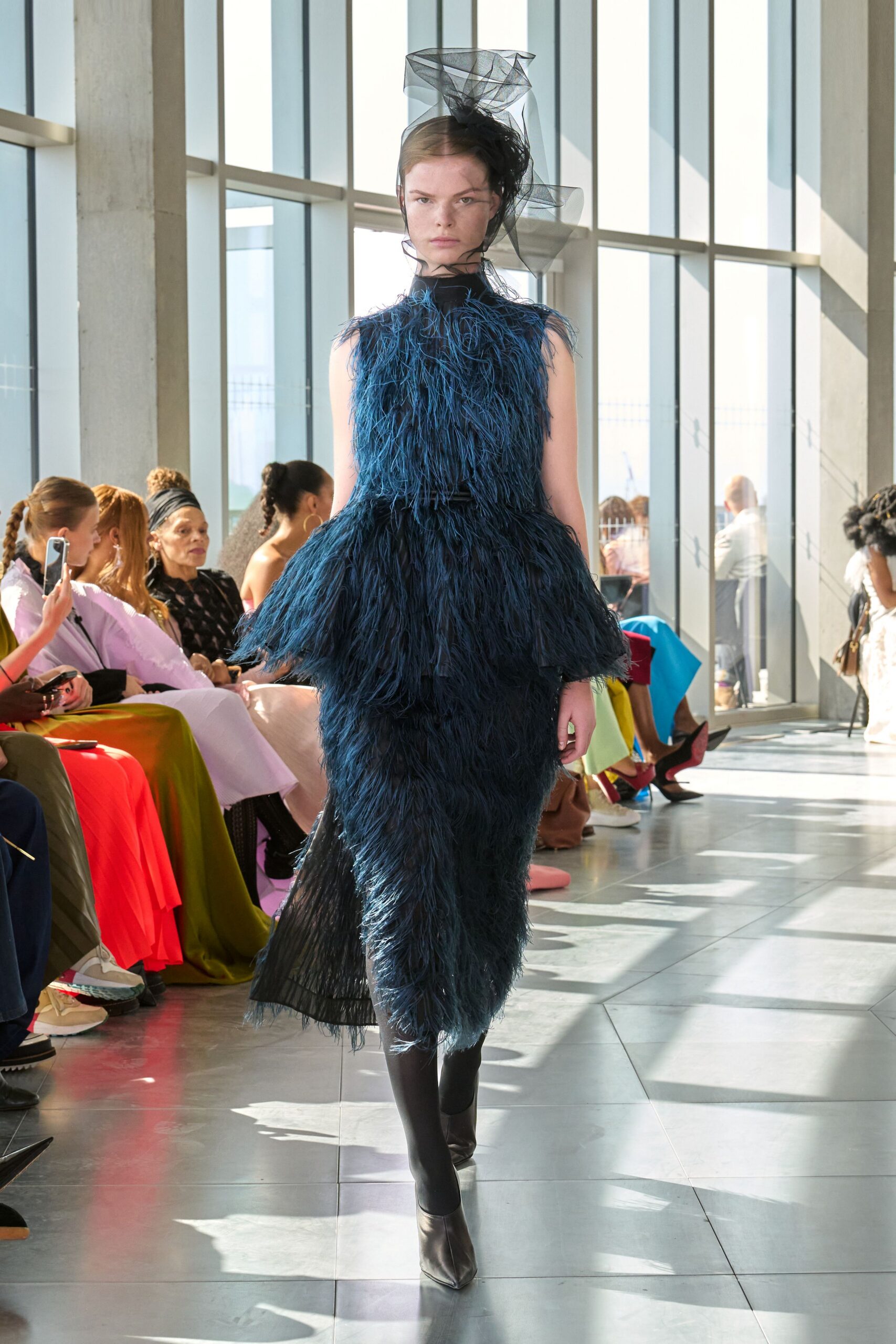 blue feathered midi dress with black shoes