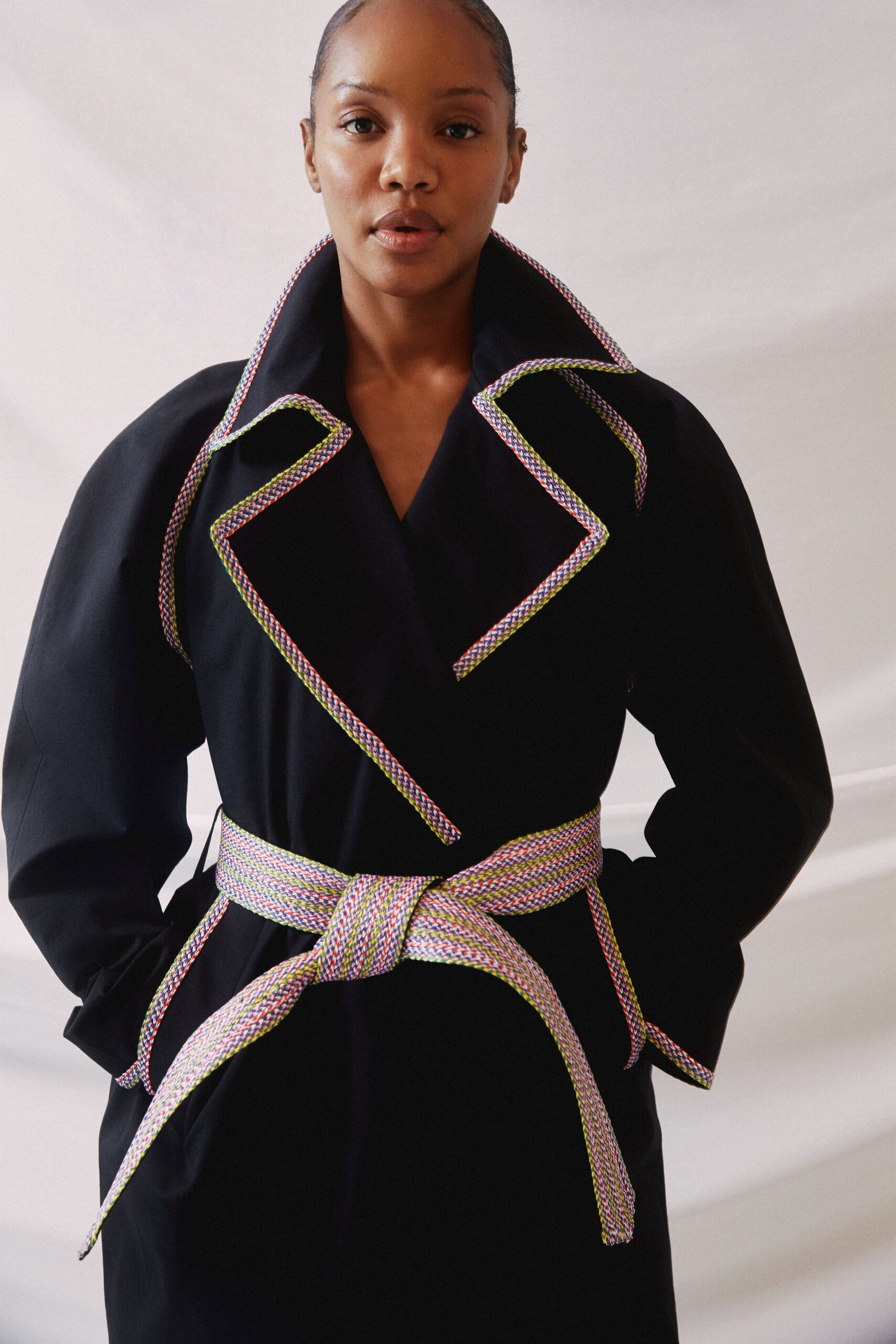 black fitted coat with belt