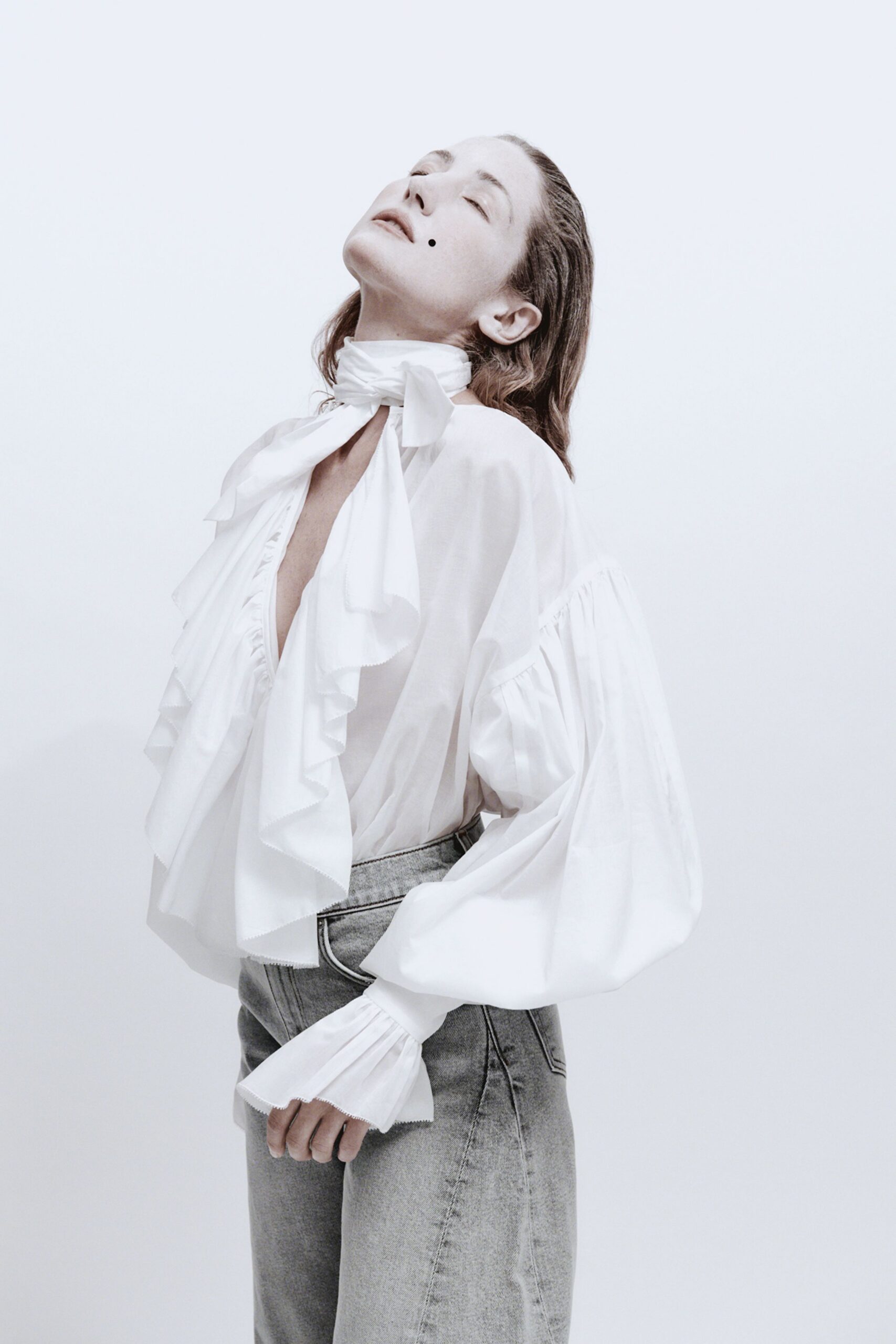 white cotton long-sleeve v-neck relaxed ruffled blouse